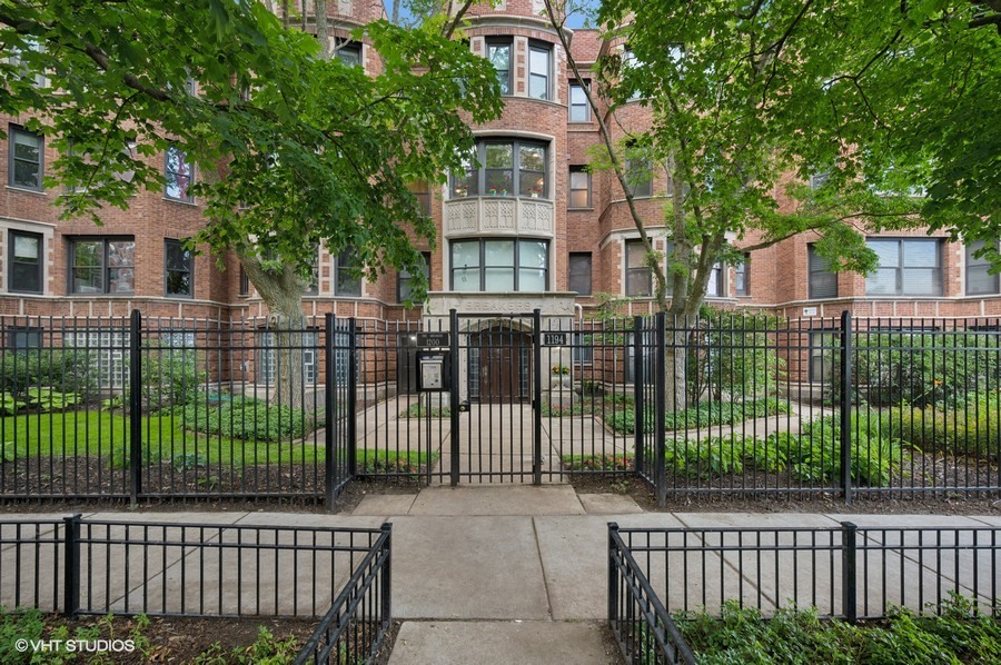 Experience breathtaking lakefront living and the relaxing sound of crashing waves in this hidden gem of a 1920s building nestled along the serene north Chicago shoreline. This premier residence features one of the most coveted floor plans in the building, offering uninterrupted, direct views of the lake and the building's private beach. Inside, discover treasures like venetian plaster walls, huge bay windows, coffered ceilings, radiant heat flooring throughout, and a beautiful gas fireplace with limestone surround. A generously sized living room abuts an open gourmet kitchen and separate dining space, all awash in spectacular sunlight. The chef's custom kitchen is a culinary dream, boasting European wood cabinetry, a breakfast bar with granite countertops, and high-end stainless steel appliances. The en-suite primary is a serene retreat with southern exposure, summer treetop views and seasonal lake views. The bonus/study area is perfect for a work-from-home office space or just reading and relaxing. You'll also find an expansive custom walk-in closet, and a spa-inspired bathroom featuring a custom steam shower and abundant storage. The second bedroom also enjoys a southern treetop exposure and shares a Jack and Jill bath for convenience. Great closet space plus additional storage, Space Pac a/c, in-unit laundry and attached heated garage parking. Outdoor living is elevated with access to a gorgeous private terrace complete with outdoor furnishings, umbrellas, outdoor fireplace, and both gas and charcoal grills. Enjoy your own private beach for swimming and for watercraft, which can be stored in a convenient boatroom located on the main floor. Host unforgettable gatherings in the elegant lobby or on the terrace, both suitable for intimate get-togethers and large-scale events. One of only two tiers in the building that features radiant floor heating. Plus, one of the best layouts available offering the ultimate in lakefront viewing. Don't miss this rare opportunity to live in a home that combines historic charm with modern luxury in a setting that feels like a year-round vacation. Truly a rare luxury, and home!
