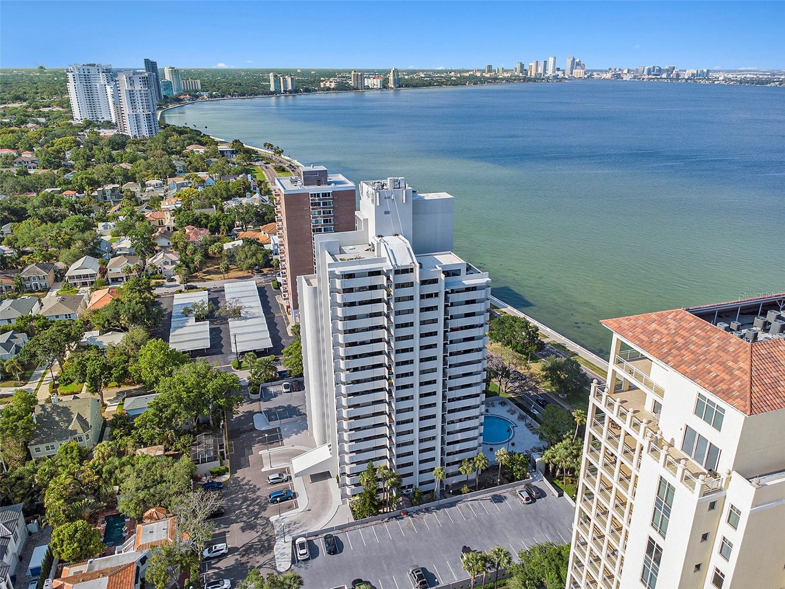 Discover the epitome of luxurious waterfront living at the renowned Pinnacle Condominiums with breathtaking views of Tampa Bay and Bayshore Boulevard. Beautifully renovated with two balconies, open floor plan, and three bedrooms. Step inside your new home with new wood cabinets, quartz countertops, large island with breakfast bar and newer appliances, complemented by new tile flooring throughout. You are Hurricane ready with PGT rated doors and sliders, installed in 2018, provide peace of mind while allowing natural light to fill the space, enhancing the home’s modern design and inviting warmth. There are no bad views as you unwind and enjoy the peaceful Feng Shui of flowing water and gentle breezes in total privacy on the main balcony or have a quiet morning coffee from the 3rd bedroom’s smaller private balcony. All the bedrooms are generously sized with the primary and third bedroom having en-suite bathrooms with beautifully updated walk-in showers. The second bedroom shares the hallway bathroom that has also been updated. Residents of The Pinnacle enjoy resort-style amenities including an outdoor swimming pool, game room, gathering room, 15th-floor aerobic and weight rooms, secured access, storage rooms, ample guest parking, and covered garage parking. The crowning jewel of the community is the 16th-floor observation decks, where you can take in panoramic views of South Tampa, Tampa Bay, and even witness space launches—an extraordinary
experience for residents and guests alike. Located just minutes from downtown Tampa, Water Street, MacDill AFB, top-tier shopping, dining, and scenic Bayshore Boulevard, this exceptional condo seamlessly blends modern luxury with the tranquility of waterfront living.