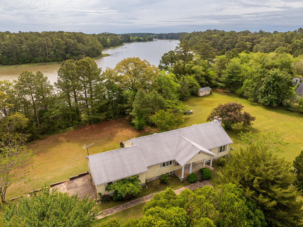 Looking for peace and privacy? This 3-bedroom, 2-bath home sits on 2.7  acres with 500+ feet of waterfront views. It's a fixer-upper with tons of potential,  perfect for anyone ready to put in a little work and make it their own. Enjoy the nature and its serene surroundings. Don't pass up this chance to create your dream retreat. Sold as is.
