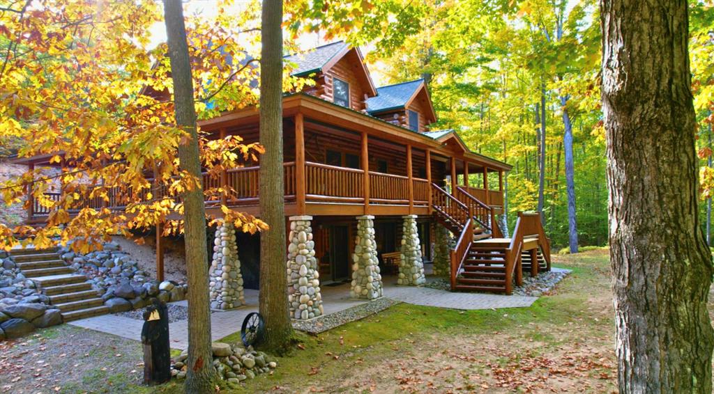 DESCRIPTION
Custom Log Home on 180 Acres - Petoskey, Michigan
At the end of a private, winding drive, surrounded by 180 acres of rolling hardwoods and pristine wilderness, sits a home that perfectly captures the heart of northern Michigan living. This 3,061- square-foot custom log home isn't just a house - it's a retreat, a gathering place and a statement of craftsmanship. With mature timber, panoramic views and an immaculate interior filled with handcrafted detail, this property offers a rare blend of rustic beauty and modern comfort. Located just 12 miles from Petoskey and 10 miles from Indian River, this estate lies in one of Michigan's most sought-after regions. World-class lakes, rivers, trails and charming small towns are all within easy reach, yet the property itself offers total peace and privacy. Whether you're here for the hunting, the scenery, or simply the quiet of the woods, this home delivers it all in one breathtaking package.
The Land: 180 Acres of Natural Beauty and Opportunity
The property features approximately 180 acres of mature northern Michigan timber, with about 140 acres enclosed by a one-wire fence around the perimeter. An established trail system winds throughout the land, providing easy access to every corner - perfect for ATVs, snowmobiles or scenic walks. Stands of oak, maple, pine and spruce fill the landscape, giving the property a classic northern character. For hunters and outdoor enthusiasts, the setting is exceptional. Deer, turkey, bear, and small game are abundant, and the property's mixture of thick cover and open ground provides ideal habitat. The owner has enjoyed years of hunting success here, with privacy and surrounding natural land helping to ensure a healthy game population. Beyond recreation, this land also holds solid investment potential. The mature timber stands carry significant value, offering the new owner an opportunity for selective harvesting and long- term return on investment - all while maintaining the natural beauty of the forest.
The Home: Rustic El