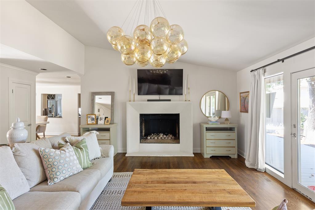 Located in a quiet cul-de-sac of Quail Creek, this thoughtfully designed 3 bedroom 2 bathroom home is completely move-in ready. Some special features include vaulted ceilings in the primary bedroom and living room, a double-sided wood burning fireplace, high-end light fixtures, crown molding, and hardwood floors throughout. The kitchen is appointed with granite countertops, stainless steel appliances, marble backsplash, and a comfortable informal dining, and opens to the spacious formal dining room perfect for hosting. The spacious primary suite includes custom built-ins, separated vanities, soaker tub, walk-in shower and closet as well as access to the deck in the backyard. Outside you will find a deck spanning across the entire house partially covered by a pergola, and overlooking a fully landscaped backyard with large mature trees, garden beds, and a fescue yard.The location offers easy access to highways, grocery stores, businesses and restaurants on May Ave and Lake Hefner. HVAC system 2026, Hot Water Tank 2025, Pergola/Deck 2024, Primary closet remodeled 2023.