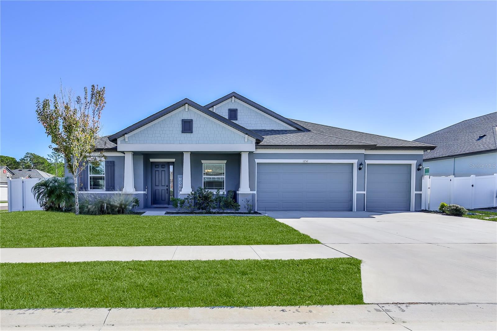 STUNNING 2023 WILLIAM RYAN CRAFTSMAN | 5 BED + HUGE FLEX ROOM (POSSIBLE 6TH) | 4 BATH | 3-CAR | IMPACT WINDOWS | ENERGY EFFICIENT Welcome home to this beautiful 2023 William Ryan Craftsman Joyce Model in the boutique community of Whiting Estates, featuring a low HOA of 95/month and a location that makes commuting a breeze with quick access to the Suncoast Parkway for Tampa and surrounding areas. From the moment you arrive, you'll love the welcoming curb appeal, corner-lot setting, sidewalk-lined streets, and the classic charm of a front porch—plus a back porch overlooking a large backyard with vinyl fencing, perfect for play, pets, entertaining, or simply relaxing. Inside, this home was designed for comfort and ''room to grow'' with 10-foot ceilings, 8-foot interior doors, and impact windows throughout. The layout offers five generously sized bedrooms, four full bathrooms, and an incredible upstairs flex room (approx. 675 sq ft) with a closet—ideal as a media room, game room, home office, or optional 6th bedroom. The heart of the home is the gourmet kitchen, showcasing white shaker cabinetry with crown molding, soft-close features, a gray shaker island, under-cabinet lighting, quartz countertops, and a timeless beveled subway tile backsplash. Enjoy high-end stainless appliances including a double oven (with convection and microwave capability), cooktop, chimney-style vent hood, double-drawer refrigerator, a large pantry, and an undermounted single-bowl stainless sink—a true chef's dream. The primary suite is a private retreat, spacious enough to accommodate a sitting area, and features a beautiful bay window that fills the room with natural light. The spa-like primary bath offers a soaking tub, walk-in shower, dual square undermounted sinks, shaker cabinetry, and quartz countertops, plus a huge walk-in closet. Added feature: this home is energy efficient with foam-injected block walls, plus it's already prepped for future upgrades with 80-amp pool pre-wire and laundry tub pre-plumbing. You'll also appreciate the peace of mind of a transferable structural warranty. Located in the highly desired Nature Coast school zone, and just minutes from local favorites like Anderson Snow Sports Complex and the Suncoast Bike Trail, this home truly checks every box. Move-in ready, beautifully upgraded, and absolutely stunning—schedule your private showing today!