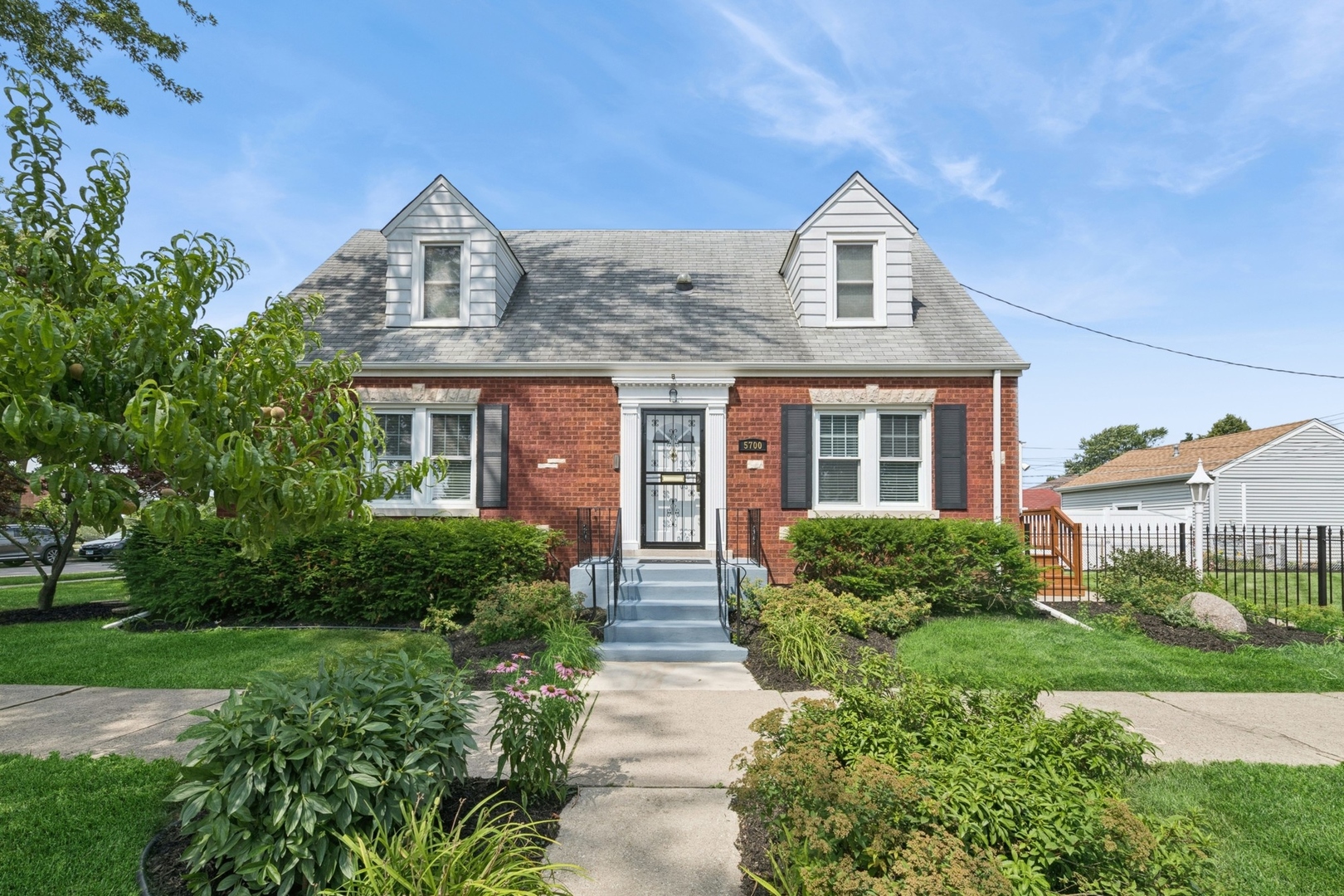 Do not miss this meticulously maintained 3br/2bath 1.5 story brick Cape Cod, ideally located on an oversized 39.1' x 125.26' corner lot in the heart of Portage Park. Built in 1948, this move-in ready home blends timeless charm with thoughtful modern upgrades and beautifully landscaped front/rear yards and a paved patio - ideal for everyday living and entertaining. Enjoy ample 24/7 street parking and a spacious, light-filled floor plan featuring oak hardwood floors throughout the first and second levels. The updated kitchen is a chef's dream, complete with Silestone quartz countertops, custom 36" KraftMaid cabinetry, Italian porcelain tile floors, and high-end appliances-including a Viking range, Vent-A-Hood commercial exhaust, and KitchenAid refrigerator and dishwasher. The home features three spacious bedrooms, two full bathrooms: a first-floor vintage bath with a reglazed cast iron tub and a fully updated second-floor bath with new fixtures and finishes. A heated rear porch with new flooring, 220V electric wall heater, and solar motion-sensor lighting offers year-round comfort.  The full basement boasts approximately 6'9" ceiling height (floor to joist), steel beam construction, a new double sink laundry tub, and convenient exterior access - ideal for an in-law or nanny retreat. Recent mechanical upgrades include: New 200amp (2002) & 100amp (2005) electrical service with updated wiring throughout, New 50-gallon high-efficiency Rheem hot water heater (2025), New RUUD high-efficiency furnace & central A/C with Smart Ecobee thermostat (2024), Updated copper plumbing with 1" lead-free service line to the street (2023) , New gas service lines and connections (2025), New sump pumps (2024)  The heated, oversized garage includes a 50amp panel (2025), EV charging outlets (front and rear), generator hookup, new smart garage door opener, and GFCI exterior outlets.  Additional features: Professionally landscaped yard w/new sod 2025, New paint (Benjamin Moore) throughout interior and exterior (2024-2025), New cement finish on front stoop, Updated lighting, electric, and thresholds throughout porch and basement, New window and door trim, crown molding, and woodwork details, Cat 5, cable, and hardwired landline conduit access (2nd floor and basement)   Just two blocks from Portage Park and close to Six Corners, restaurants, transit, and expressways (I-90/I-94), this home offers convenience, comfort, and style in one of Chicago's most desirable neighborhoods.