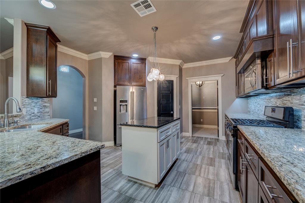 Welcome to this spacious 3-bedroom, 2-bath home in the Rockwell Parke neighborhood, located within the Deer Creek School District. This home features an open floor plan with a large living area and a gas-log fireplace. The kitchen offers ample cabinetry, generous countertop space, and modern finishes. A dedicated study/office provides a convenient workspace. All bedrooms are well-sized, and the primary suite includes a large closet and an en-suite bath.Enjoy outdoor living with a covered front porch, covered back patio, and a gas connection for a grill. The 3-car garage provides additional storage and parking. Neighborhood amenities include a community pool, park, covered picnic area, soccer field, and basketball court. Conveniently located near shopping, dining, and major highways.