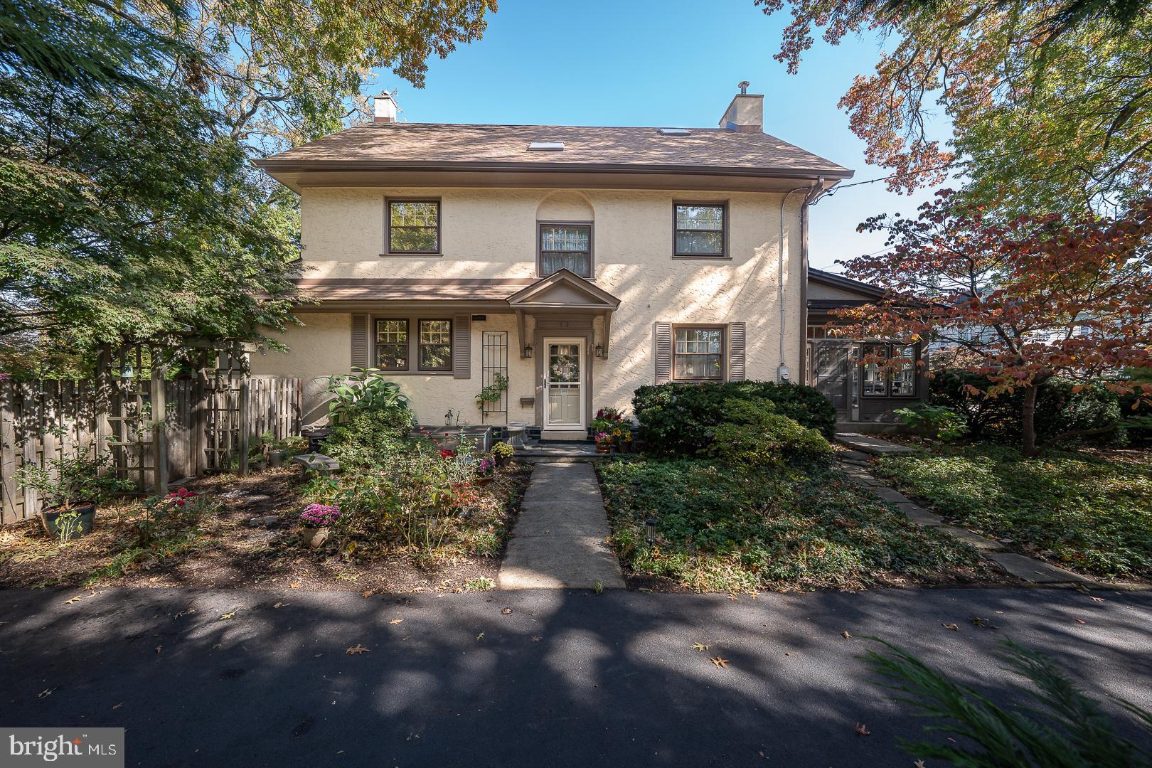 Ardmore PA • 5BR • 3BA • 0.23 Acres • Walk to Train • 2-Car Garage • Finished 3rd Floor • Fenced Yard • Lower MerionRoom to grow. Room to gather. Room to breathe.Space, flexibility, and walkable convenience come together at 124 Grandview Avenue in Lower Merion Township. Offering 2,922 square feet above grade on one of the three largest lots on the street, this detached single delivers character and scale rarely found this close to the heart of Ardmore within walking distance to the train, parks, shops, and restaurants.A welcoming foyer opens into a large, bright living room with original hardwood floors and a wood-burning fireplace. Beyond, a side porch with stunning windows on 3 sides provides flexible space for a den, office, art studio, playroom, or whatever you might need. Stunning windows are a theme throughout the first and second floor – all huge, drenching the spaces in light. The hardwood continues into the dining room, where a pass-through connects seamlessly to the kitchen. A previous owner used the dining room as a bedroom and built a full bath right next to it – so, a full bath on the first floor. Designed for both everyday living and entertaining, the efficient, beautifully renovated kitchen is a cook’s delight with soft-close cabinetry, granite countertops, stainless appliances, a porcelain double sink, 6- burner gas stove, and TWO modern pantry areas with spacious custom cabinetry.A mudroom off the kitchen completes this level and leads to a rear patio overlooking the fully-fenced backyard. As one of the 3 largest lots on the street, the outdoor space offers room to garden, gather, or simply be, with privacy, peace, and quiet. Fabulous trees shade the patio. There are 2 100-year-old oaks and one 100-year-old maple on the property and many  perennial plantings: roses, rhododendrons, azaleas, hydrangeas, daffodils, cannas, hollyhocks. A loooong driveway and two-car detached garage provide rare and plentiful off-street parking. Chickens are legally permitted and a luxury walk-in coop and aviary, replete with 7 gorgeous hens, is included, if desired!The second level includes 3 generously-sized bedrooms and a bright neutral hall bath with tub-shower combination. Huge, gorgeous windows in each room. The primary bedroom is massive and has the potential for a walk-in closet AND an en suite bath. The finished third floor adds two additional bedrooms, big closets, and a full bath, creating flexible options for guests, workspace, or an alternate primary suite.Throughout, there is a delightful combination of contemporary updates and old-world character. An unfinished basement offers storage, laundry, bilco doors to the back yard, and future potential. A 2-yr old gas heating system and a whole-house fan provide year-round comfort. The electrical system has been completely rewired in recent years. This location is unmatched. Walk to the bus or train, Linwood Park, Ardmore Park, the library, Carlino’s, Suburban Square, Trader Joe’s, the Ardmore Farmers Market, Whole Foods, and the new Ardmore Avenue Community Center / PALM Center. Space when you want it. Convenience when you need it. All in the heart of Ardmore.