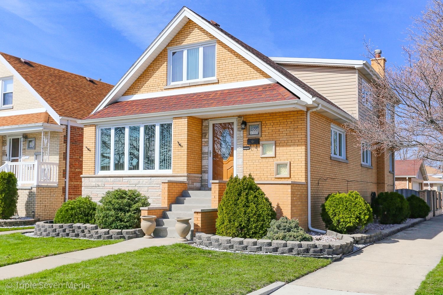 Discover this charming 2.5-story brick home located on a corner lot, featuring a fenced backyard, 2-car garage with a convenient side driveway. First floor offers three spacious bedrooms, a full bathroom with a whirlpool Jacuzzi, and a large kitchen with custom cherry wood cabinetry, granite countertops, and stainless steel appliances. Step out into the bright sun room filled with natural light overlooking the backyard. On the second floor you'll find a full bathroom, two additional bedrooms including a spacious master, and a loft area ideal for a home office. The fully finished basement provides additional living space along with a full bath, utility and laundry room, and a custom cabinet wet bar-great for entertaining. The home has ample storage throughout to meet all your needs.
