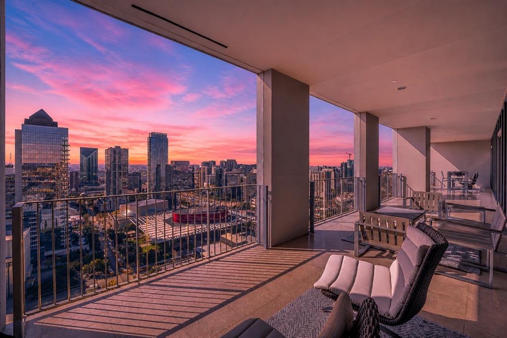 Experience elevated luxury living in this breathtaking penthouse residence at One Arts Plaza, perfectly positioned above the vibrant Downtown skyline and renowned Dallas Arts District. Designed with impeccable attention to detail, this extraordinary home blends sleek contemporary architecture with refined sophistication at every turn. Rich hardwood flooring, gallery-style walls, soaring 11-foot ceilings, and automated shades create a dramatic yet inviting atmosphere, while expansive floor-to-ceiling windows frame stunning panoramic city views and flood the interiors with natural light. An advanced lighting system sets the perfect ambiance for both everyday living and elegant entertaining.At the heart of the residence, the chef’s Bulthaup kitchen is a true showpiece, featuring full-height lacquer cabinetry, premium Miele appliances, gas cooktop, SubZero refrigeration, dual wine refrigerators, and a dedicated ice maker. A sophisticated wet bar seamlessly connects to the expansive living and dining spaces, where dual seating areas offer effortless flow for intimate gatherings or large-scale entertaining against the dazzling backdrop of the Dallas skyline.The private primary suite is a serene retreat, complete with a dedicated study, a spa-inspired marble bath, and a custom Poliform closet designed to rival the finest luxury boutiques. Combining world-class design, unmatched amenities, and an iconic location in the heart of Dallas, this one-of-a-kind penthouse delivers an exceptional lifestyle defined by elegance, comfort, and modern sophistication.