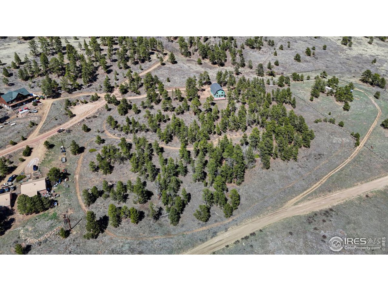 A "Rocky Mountain" Home Like No Other. This stunning 3-bedroom, 2-bathroom home isn't just a place to live; it's a destination. Nestled among towering pines and aspens, and surrounded by panoramic mountain views. This 9.45 acre property adjoining Roosevelt National Forest, has many flat and buildable spaces for outbuildings, gardens or even a horse barn. An oversized 2-car garage w/room for cars and toys and a large workshop or storage room, offers direct access to an endless array of outdoor adventures year-round. In summer, explore miles of hiking and biking trails that weave through wildflower meadows, aspen groves, and along mountain ridges with views that stretch for miles. Paddle or fish in nearby lakes, or spend the day rock climbing, trail running, ATVing, or horseback riding in the surrounding wilderness. World-class skiing, snowboarding, snowshoeing, and cross-country trails literally just out the door. Wildlife sightings are part of daily life here-elk, moose, foxes, and hummingbirds all make frequent appearances. If you're seeking full-time residence, seasonal home, or an investment property, its unbeatable combination of location, design, and access to outdoor recreation make it a rare opportunity for anyone who loves the mountains. The house boasts 400 Amp power service making it perfect for a wood worker, machinist or other specialized hobbyist. High-speed internet makes it easy to work remotely and stay connected. Live where others vacation. The expansive front porch invites you to take in the beauty that stretches in every direction. Inside, the home welcomes you with an open-concept design.