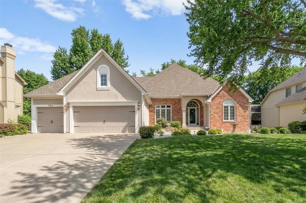 Meticulously maintained Don Julian built home situated in the sought-after Lakewood community on a cul-de-sac lot! Gleaming hardwoods, wall of windows and soaring ceilings highlight the great room with gas fireplace. The updated kitchen features painted cabinets, glass tile backsplash and Quartz counters. The hearth room walks out to the new composite deck overlooking the patio and level backyard—perfect for relaxing, grilling and entertaining! The spacious primary suite offers hardwood floors, recessed ceiling, walk-in closet, and private bath with double vanities, whirlpool tub, and separate shower. A second bedroom, 2nd full bath, formal dining and laundry room complete the main level. The second floor includes two generously sized bedrooms, both with walk-in closets and a full bath with luxury vinyl tile flooring. The finished walkout lower level provides a spacious family room and rec area and is stubbed for a fourth bathroom, plus ample storage and a brand-new furnace. Enjoy incredible neighborhood amenities including pools, swim teams, tennis/pickleball courts, playgrounds, walking trails, and lake access. Fantastic location close to shopping, dining, highways, and top-rated Blue Springs schools.