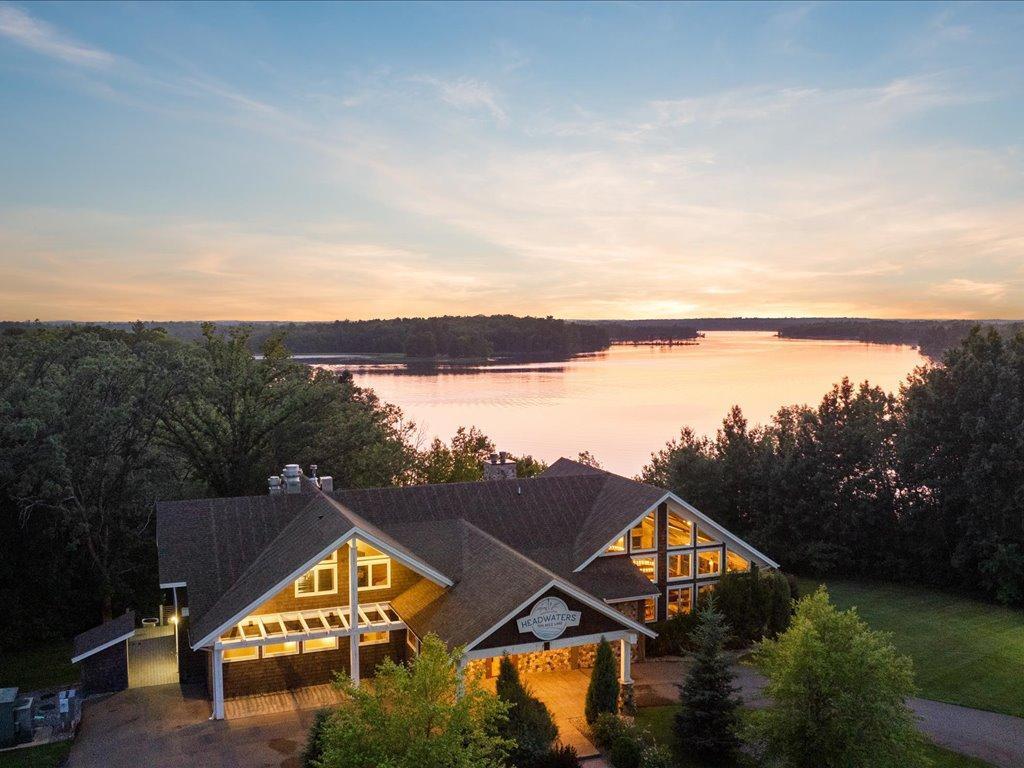 Rare opportunity to own a premier lakeside commercial property on the shores of sought after Ten Mile Lake in Hackensack, MN. This turn-key facility offers stunning westerly facing panoramic lake views and unforgettable sunsets. The perfect setting for a destination business with high visibility from both Highway 371 and Ten Mile Lake. This iconic property includes an 8,512 ft facility perfect for restaurant, event, or hospitality use, with expansive spaces and breathtaking views throughout.

Formally a successful restaurant, the building features a 4,240 sq ft main level restaurant with expansive windows creating exceptional natural lighting. A large outdoor dining deck, with picturesque sunset views. The lower level includes 2,576 sq ft of storage and commercial grade "Norlake" walk-in coolers/freezers. The upper-level offers three functional living units. Efficient and ideal for staff housing or rental income. This property boasts a private dock with approximately 29 ft. of shoreline frontage on Ten Mile Lake, allowing guests to arrive by boat and enhancing the customer experience.

With its flexible layout, well maintained kitchen, bar infrastructure, and prime location in the heart of lake country, this property is ideal for a restaurateur. This one-of-a-kind lakefront facility delivers an unmatched atmosphere, functionality, and investment potential. Don't wait!