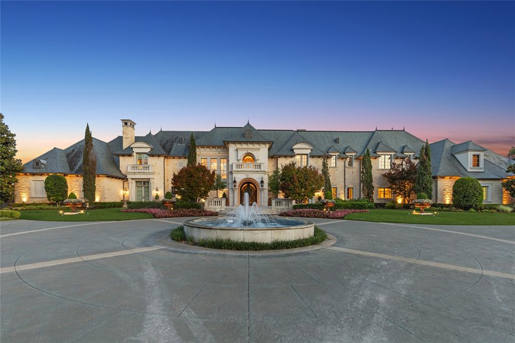 Welcome to Château Lumièr, a private, gated estate nestled on 15 wooded acres with coveted ag exemption, three stocked ponds with fountains, and rare serenity in the heart of McKinney, south of SH 380. Masterfully crafted by Sharif Munir from the finest materials and designed with French Chateau elegance in mind, this architectural jewel balances grandeur and intimacy across every inch. Step through double iron doors into soaring ceilings, gold leaf accents, and handmade Bordeaux flooring. Entertain effortlessly in formal and casual spaces alike, each adorned with bespoke finishes: groin vault ceilings, coffered beams, antique appliqués, and Italian marble. The chef’s kitchen is outfitted with luxury appliances, hand-painted tiles, and custom maple cabinetry, anchored by an impressive China and Silver Room featuring Carrera marble and herringbone wood floors. The Great Room commands attention with cathedral-beamed ceilings and five sets of French doors opening onto the veranda, overlooking manicured grounds and outdoor living anchored by a fireplace and full kitchen. The owner’s wing includes dual bathrooms, dual closets, a second office, a fireplace, a workout room, and breathtaking views. Wine connoisseurs will appreciate the climate-controlled wine room and film lovers, the private media suite with digital projection. A whole home generator, 1000' deep private well, and an elevator reflect the estate’s blend of beauty and self-sufficiency. Relax and enjoy panoramic views from every room of this residence. Additional features include spacious bedroom ensuites with luxe finishes, separate guest quarters with private entrance, full kitchen and 2 bd 2 bth; a mahogany study with pocket office & imported African marble; game + craft rooms, a playhouse with electricity. Château Lumièr isn’t simply a home, it’s a legacy property where artistry meets livability in a world of its own. Attends McKinney ISD.