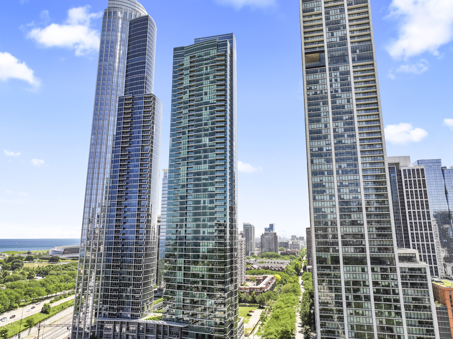 Welcome to the 47th floor of 1201 S Prairie - where jaw-dropping views, sleek design, and luxury finishes come together in one seriously impressive South Loop home. Unlike any other unit in the coveted "02" tier, this 2-bed + den, 2-bath unit is fully updated and offers panoramic lake, skyline, and park views that'll stop you in your tracks. Whether it's sunrise coffee or sunset cocktails, the balcony  delivers front-row seating to some of the best sights in the city. Inside, you've got floor-to-ceiling windows in every room, flooding the space with natural light and giving the whole home that airy, elevated feel. The kitchen is a stunner - flat-panel cabinets, quartz countertops, high-end appliances, and a huge breakfast bar that's perfect for entertaining or just spreading out with takeout. Open-concept living and dining flow seamlessly, with a bonus nook perfect for a home office or reading corner.  The primary suite is your own peaceful retreat, complete with a walk-in closet and spa-like bath featuring a soaking tub, separate shower, and double vanity. The second  bedroom is spacious and bright, and the second bath is beautifully finished with modern tile and fixtures. Recent updates include new flooring, recessed lighting, fireplace, guest bath with walk-in shower, drapery, and more. This full-amenity building doesn't skimp - think indoor pool, gym, lounge, 24-hour door  staff, and more. Plus, you're just steps from the lakefront, Grant Park, the Museum Campus, and all the South Loop favorites. Garage parking available and storage included. Unit can be available fully furnished for an additional cost for truly turnkey living. Come for the views, stay for the lifestyle; schedule your showing today!