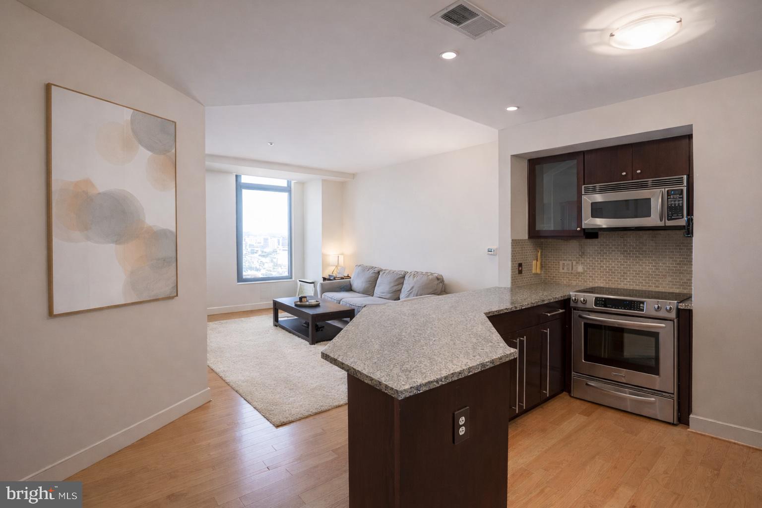 Experience elevated city living at The VUE in the heart of Harbor East. This one-bedroom, one-bath condo features large windows that provide abundant natural light and beautiful views, new  floors, updated carpet, and a modern kitchen with stainless steel appliances.The bathroom offers a spacious walk-in shower, and the convenience of in-unit laundry includes a new washer and dryer.Enjoy full-service luxury with 24-hour security, concierge service Monday-Saturday, secure package delivery, and one deeded covered parking space, plus guest parking.Residents have access to premium amenities including a dog park, EV charging, bike storage, and direct access to Harbor East Cinemas and the Coppermine gym.Step outside to Baltimore's most vibrant neighborhood-just moments from top dining, boutiques, Whole Foods, Starbucks, the waterfront promenade, and the Water Taxi. With easy access to downtown, stadiums, Johns Hopkins, Penn Station, and BWI, this home offers ideal city living with exceptional convenience.