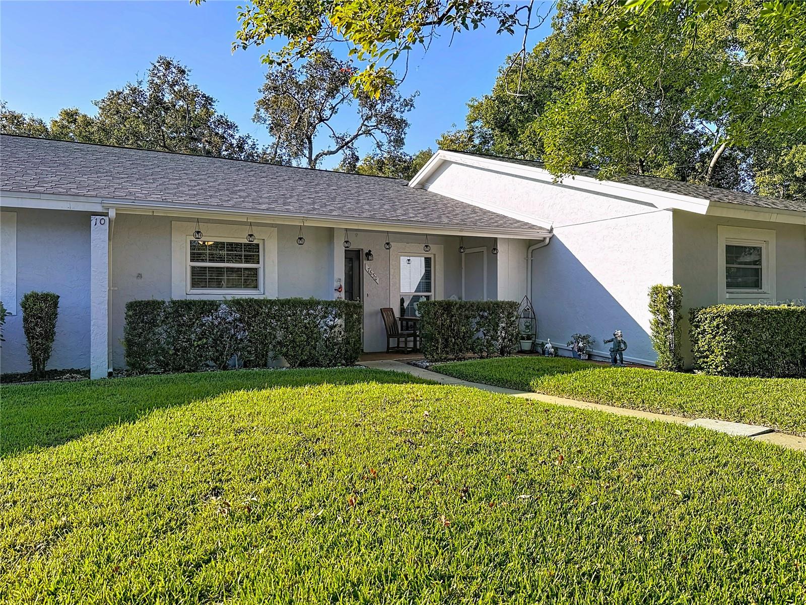 Move-in ready, this stunning 2-bedroom, 2-bath condo in the desirable 55+ Beacon Woods Golf Club Community has been completely updated throughout. Enjoy a modern kitchen, luxurious master bath, and beautifully renovated secondary bath. The open-concept great room offers seamless living and dining spaces, complemented by hurricane impact windows (2023) and a private wooded view. Amenities include a heated pool, lighted tennis courts, bocce ball, shuffleboard, and an active clubhouse with countless activities. One small pet allowed. The $465 monthly fee covers cable, insurance, roof, lawn, water, sewer, trash, and reserves. Conveniently located near beaches, medical facilities, and Tampa attractions. A perfect blend of comfort, style, and Florida living.