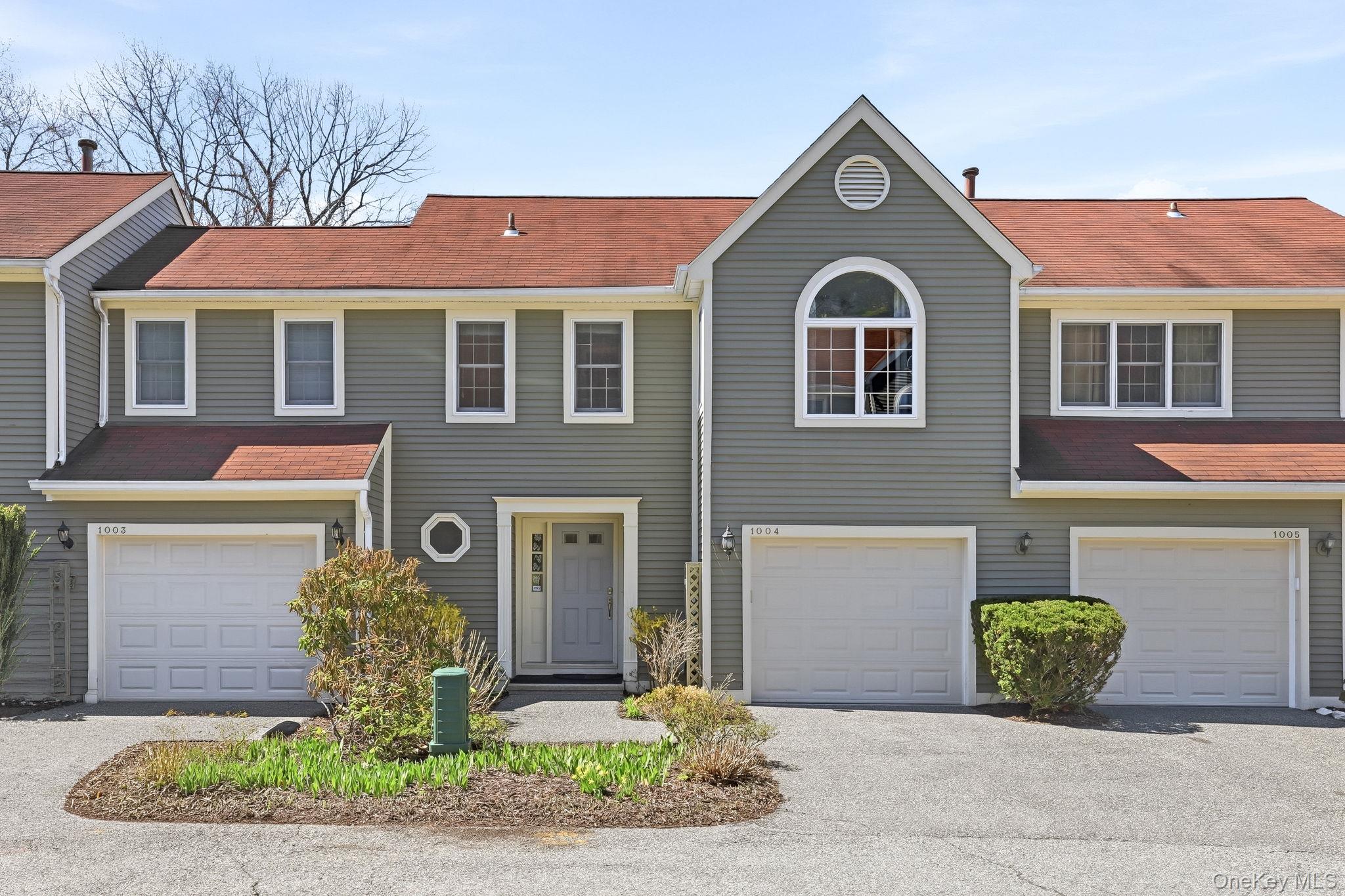 Welcome to Guard Hill Manor in Mount Kisco. This bright 2-bedroom, 2.5-bath townhome offers an open layout with soaring ceilings, fireplace, and abundant natural light from south and west exposures. The updated kitchen features stainless steel appliances and flows seamlessly into the living and dining areas. A private balcony overlooks peaceful, tree-lined surroundings. Upstairs includes a spacious primary suite with vaulted ceilings and en-suite bath, plus a second bedroom and full hall bath. The finished walkout lower level adds approximately 327 sq ft of flexible space.New HVAC (2024) and water heater (2023). Attached garage. Convenient to Metro-North, shops, dining, and highways.
