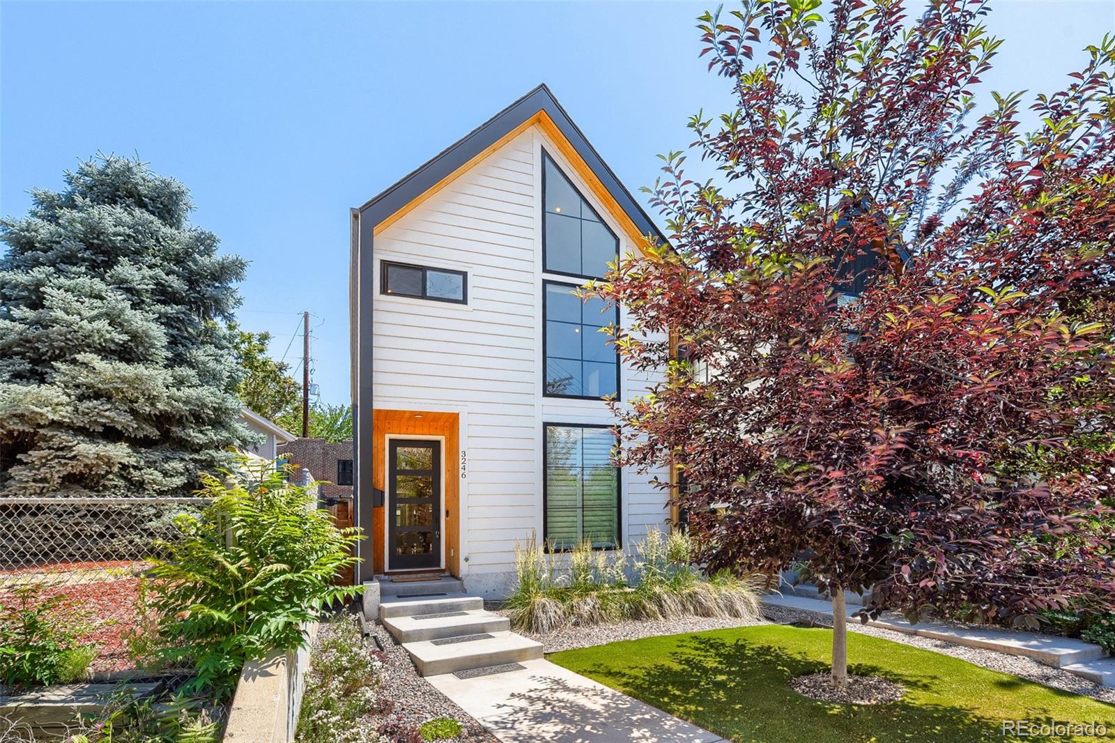 Luxury and thoughtful design define this exceptional newer construction in the highly desirable West Highland. This 5 bedroom, 4 bathroom home offers quality craftsmanship, functional living spaces, and a rare accessory dwelling unit (ADU).The main level is filled with natural light, features a dining area, black marble gas fireplace, and a beautiful kitchen with white marble countertops, an oversized island, custom cabinetry, and black fixtures.Upstairs, 17 foot vaulted ceilings highlight the spacious primary suite with a custom walk in closet and spa inspired bath featuring a soaking tub, custom shower, and dual vanities. Two additional bedrooms, a full bath, and laundry complete the upper level.The finished basement offers a large media or recreation space along with an additional bedroom suite and full bath.The property also includes a 1 bedroom, 1 bathroom ADU, ideal for guests, rental income, or multigenerational living. Parking includes a 3 car garage with two tandem spaces and one oversized stall above the ADU.Additional features include FULLY PAID solar panels, plantation shutters, cellular shades, low maintenance turf landscaping, and a 6 foot privacy fence.Ideally located in Northwest Denver, just minutes from Sloan's Lake, Highland Square, LoHi, Tennyson Street, and downtown Denver, with easy access to parks, dining, shopping, and entertainment. *3D Tour Available*