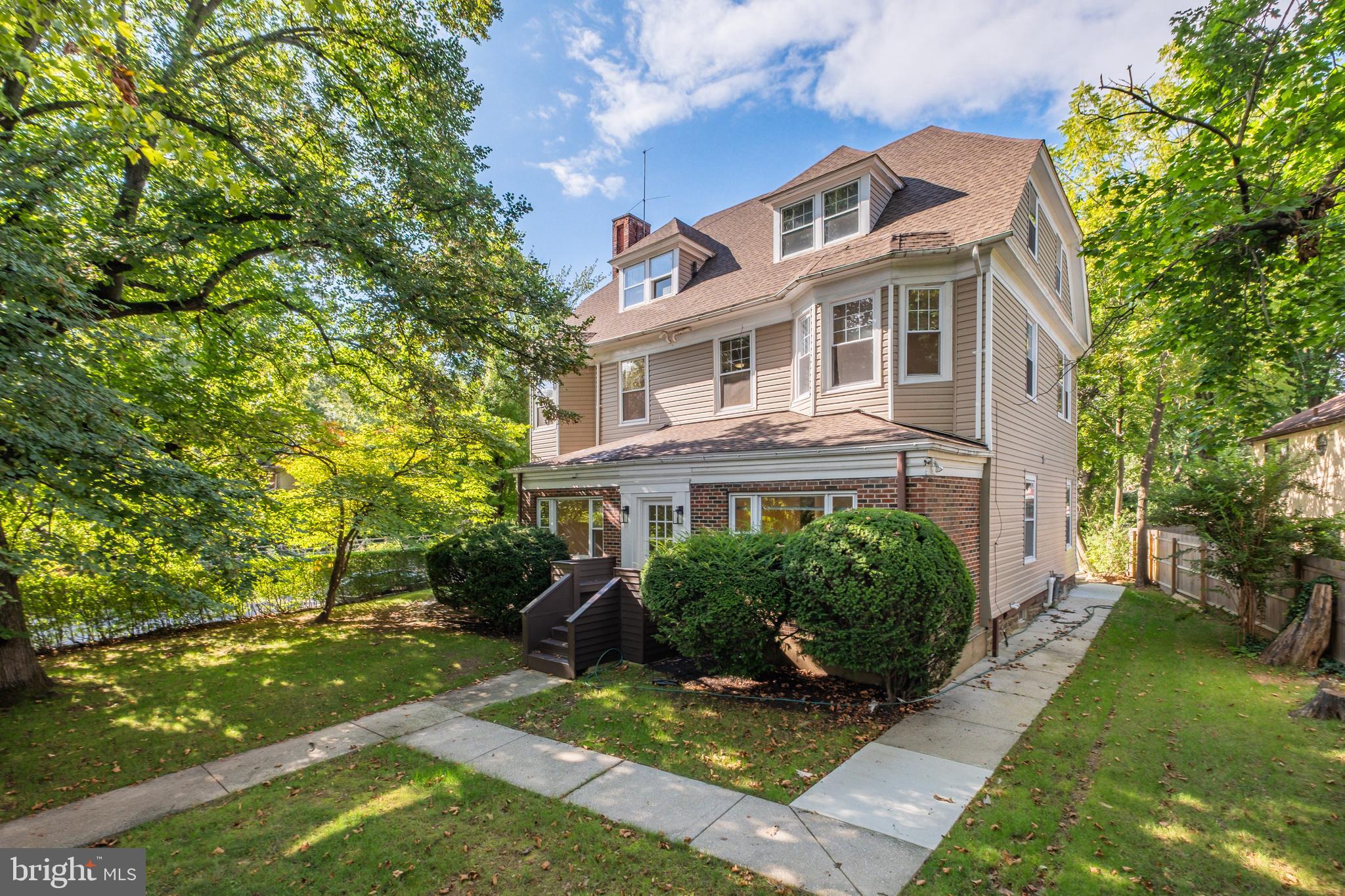 An extraordinary blend of timeless scale and modern luxury, this magnificent three-story renovated Center Hall Colonial sits in the heart of Bala Cynwyd’s most desirable neighborhood within the award-winning Lower Merion School District. From the moment you enter the grand foyer, you are greeted by gleaming hardwood floors, an impressive staircase, and soaring ten-foot ceilings that flow into an expansive main level built for both effortless daily living and grand entertaining. At the heart of the home is a light-filled Maple and Granite Kitchen/Great Room featuring a cozy fireplace, seamlessly paired with a secondary prep kitchen complete with its own sink, dishwasher, and oven. The main floor is thoughtfully designed to include a private den or home office, a spacious family room, a practical mudroom, and two convenient half baths. Upstairs, nine-foot ceilings frame a luxurious primary suite featuring a spa-like Maple and Ceramic bath equipped with a rejuvenating steam shower and whirlpool tub. Two additional bedrooms, a full hall bath, and a second-floor laundry room complete the middle level, while the dynamic third floor offers two more private bedrooms and a full bath—ideal for guests, family, or an au pair suite. Outfitted with dual-zone A/C and tucked behind mature, privacy-enhancing landscaping with convenient driveway access off Kent Road, this home provides a secluded retreat just steps from local dining, shopping, parks, the library, public transit, and the scenic Cynwyd Heritage Trail.