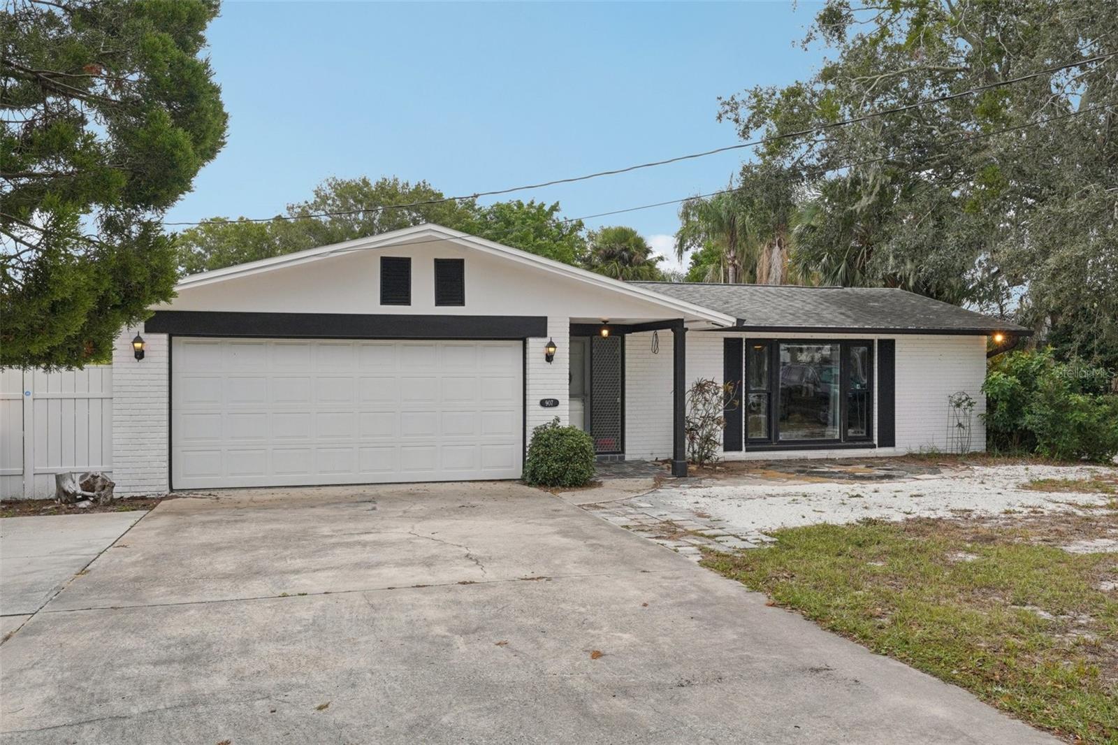 FANTASTIC LOCATION! This four-bedroom, two-bath, pool home in the charming coastal town of Tarpon Springs is just one mile from Sunset Beach’s public boat launch. Bring your boat, RV, or water toys – the oversized lot provides ample storage space, and enjoy proximity to the water with no flooding concerns from past storms. Inside, the bright front living room features large windows, fresh neutral paint, and luxury vinyl flooring throughout. The centrally located kitchen offers stainless steel appliances, generous cabinetry and counter space, a window overlooking the lanai, and open sightlines to the family and dining areas. The 300+ sq ft lanai featuring glass sliders from the family room and dining room creates seamless indoor-outdoor living. Step out to the fully fenced backyard to enjoy the refreshing in-ground pool, patio area, detached storage/hobby shed with electric, and open lawn space. No HOA or CDD. Newer windows and pool heater (2017). Ideally located near schools, Sunset Beach (1 mi), Fred Howard Park (2 mi), Howard Park Beach (3 mi), and minutes from quaint Downtown Tarpon Springs (2.5 mi) and the historic Sponge Docks (3.3 mi). Don’t miss your opportunity to own your piece of paradise with proximity and access to popular beaches, waterways, shoppes, dining, festivals, parks, trails, and more. Schedule your private tour today.