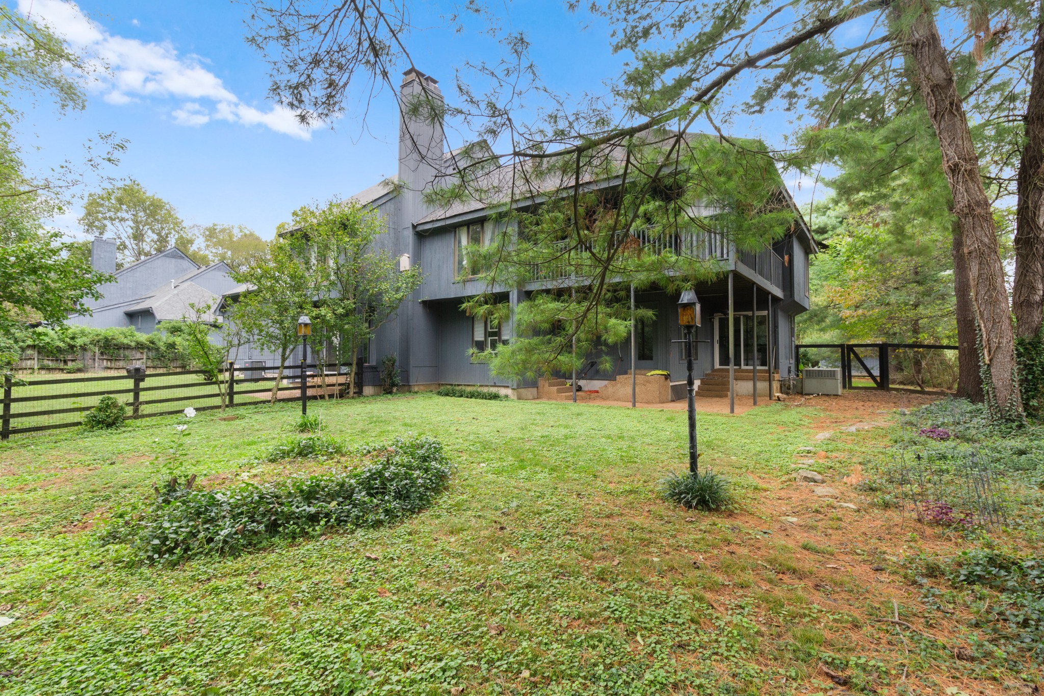 COZY, COZY, COZY!  Have you been searching for that one unique property that makes you feel like you’re on vacation, but still at home?  Nestled in an exclusive, private enclave in the heart of Brentwood, this end unit on over 2/3 of an acre is completely surrounded by mature trees, greenspace & has the feel of a tranquil mountain retreat.  Enjoy a very open, bright & airy floorplan w/tons of natural light.  The entertainer’s kitchen offers a huge working island, double ovens, the perfect ‘cooking triangle’ and a cozy spot designated for baking or a coffee bar.  Upstairs, all 3 bedrooms are oversized with views of the surrounding trees, but the gorgeous master offers a vaulted ceiling and access to the wraparound, covered porch.  Both bathrooms upstairs have been recently updated. Very private w/only 3 other neighbors & NO HOA. Location, location, location! Just minutes from the interstate, restaurants, Cheekwood, Percy Warner, shopping and a mere 2.3 miles to the popular Radnor Lake State Park. Freshly painted throughout, this wonderfully cared for home is move-in ready. Fenced backyard is perfect for pets and children. The firepit in the front yard makes socializing with family, friends and neighbors something to look forward to all year around. Part of the open space in the front yard (and the shed) belongs to this property.  **The stained glass window panels in living room do not convey.  ALL THE MAJOR MAINTENANCE ITEMS HAVE BEEN UPDATED (roof, skylight, water heater, siding, hvac). The crawlspace is fully encapsulated.