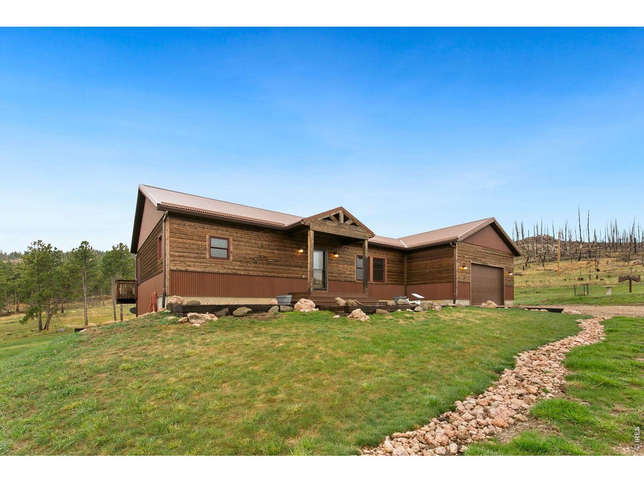 Welcome to this beautiful 3-bedroom, 2-bathroom ranch-style home nestled on nearly 7 acres in desirable Penosa Estates. Perched atop a hill, this property offers breathtaking foothills views and the perfect blend of privacy and open space. Inside, you'll find a spacious open floor plan with wood flooring throughout the main level, creating a warm and inviting atmosphere. The fully finished walkout basement provides additional living space, ideal for entertaining, a home office, or guest accommodations. Stay cozy year-round with wood-burning fireplaces on both levels, adding charm and comfort during the colder months. The home is fully electric, eliminating the need for propane. Outside, the property is well-equipped for work and storage with a large 24x42 shop and additional storage sheds, offering endless possibilities for hobbies, equipment, or business use. This property also allows you the opportunity to bring your animals! Horses, cows, pigs- or various other animals are allowed! This rare opportunity combines scenic views, usable acreage, and functional improvements-perfect for those seeking country living with modern conveniences.