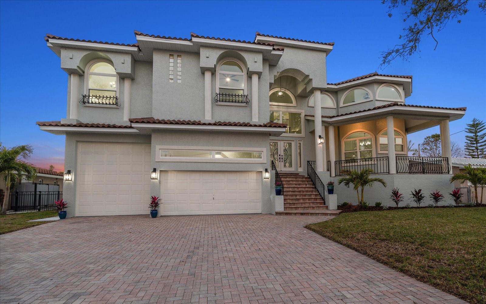 Elevated with first floor living space and a uniquely elevated pool equal with the first level living space keeps you well up and above the flood for peace of mind and adds convenience in the ability to walk directly out to your pool without having to go down to ground level. Welcome to your dream waterfront oasis on Island Estates in Clearwater Beach! This fully remodeled 5-bedroom, 4-bathroom home offers the perfect blend of luxury and functionality, ideal for a coastal lifestyle. 

Step inside to discover a spacious, open floor plan, highlighted by a stunning 1200+ sq ft master suite — a true retreat with panoramic views of the water. With brand-new, top-of-the-line finishes throughout, this home is built to impress. The kitchen is a chef's dream, featuring brand-new JennAir appliances, Zebra Cambria countertops, a gas range with a pot filler, and ample counter space. Custom Innovation cabinetry with soft-close doors adds a touch of elegance, while the central vac system makes upkeep a breeze.

Entertaining is a joy with the sparkling pool. A brand-new seawall ensures peace of mind, and the ability for the buyer to design a boat dock system to suit your needs to make this home a boater's paradise.

The roof is a brand-new Verea clay tile roof and the 3-zone American Standard HVAC system will keep the home comfortable year-round.

For those who need space, the super-large garage can accommodate up to 6 vehicles, including an RV or trailered boat bay. A new Rainbird irrigation system keeps the landscaping lush and vibrant, while new PGT impact windows and doors provide added protection and energy efficiency.

Located within walking distance to the beach, the grocery store, and Clearwater's best shopping and dining, this elevated home offers both luxury and convenience. 

Don’t miss your chance to own this exquisite waterfront property with all the bells and whistles at a value. Make this house your forever home!