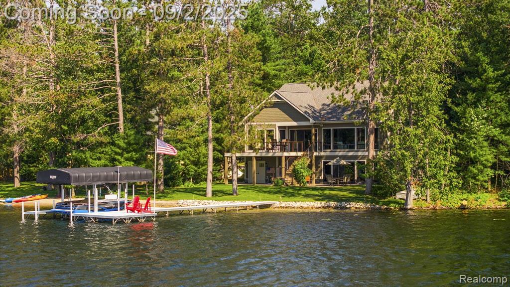 Welcome to your dream lakefront retreat! This beautifully crafted 3-bedroom, 3-bathroom home offers the perfect blend of luxury, comfort, and serene waterfront living. Custom built in 2018 on 106 feet of sandy all-sports Tee Lake frontage, this property is an ideal year-round residence or vacation getaway. Step inside to discover stunning custom Amish cabinetry throughout, a spacious main floor master suite, and an elegant formal dining room perfect for entertaining. The open-concept layout flows seamlessly to a large deck overlooking the water-ideal for summer gatherings, morning coffee, or sunrise views. The walkout finished basement and 2nd kitchen expands your living space with plenty of room for recreation and relaxation.  An additional detached heated garage adds convenient year-round storage, while the charming 1-bedroom, 1-bath bunkhouse provides extra space for guests, extended family, or potential rental income. Whether you're boating, swimming, or simply soaking up the peaceful lake views, this property offers a rare opportunity to enjoy waterfront living at its finest.