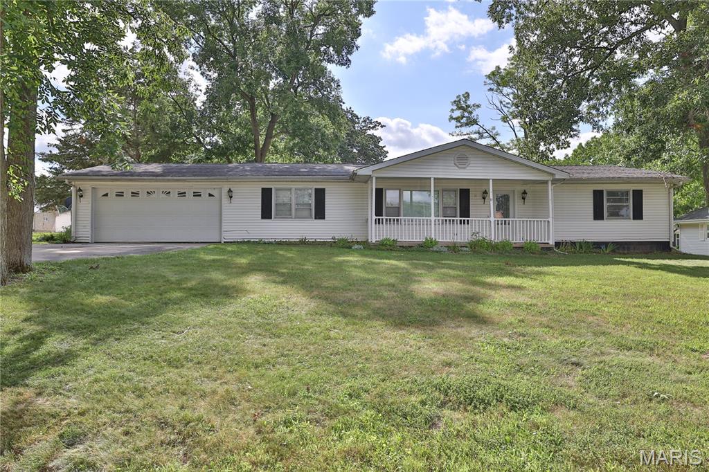 Move right into this 3 bedroom, 1.5 bath ranch style home situated on a spacious corner lot! Inside, you’ll find a cozy living room, an inviting eat-in kitchen, and a versatile dining room/family room that could easily serve as a 4th bedroom or home office. The layout includes a Jack-and-Jill half bath connecting two bedrooms, while the primary bedroom offers direct access to the full bathroom, complete with a newer shower. A generous laundry/utility room is conveniently located just off the attached 2 car garage, providing added storage and functionality. Outside, enjoy a covered front porch, concrete driveway, and a small storage shed. Conveniently located within walking distance of both the middle and high schools, this home offers comfort, flexibility, and an ideal location!