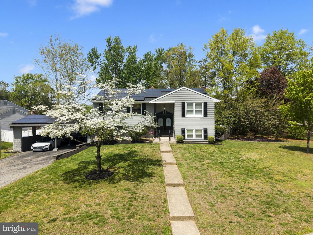 Welcome to 310 Susan Drive, Cinnaminson, NJ 08077 | Don't miss this beautifully updated split-level home in one of Cinnaminson's most established neighborhoods!  From the moment you step through the elegant double front doors with etched glass panels, you'll be impressed by the thoughtful updates and stylish finishes throughout.  The heart of this home is the stunning fully renovated kitchen, featuring navy blue shaker cabinetry, gleaming quartz countertops, a subway tile backsplash, gold hardware, a farmhouse-style gold pull-down faucet, stainless steel appliances, and eye-catching geometric pendant lighting.  A peninsula with seating for two makes this kitchen as functional as it is beautiful.  The bright and open living and dining areas flow seamlessly together, highlighted by luxury vinyl plank flooring, ceiling fans, and an abundance of natural light.  The formal dining room accommodates a full table for six and opens to the kitchen, making entertaining effortless.  The upper-level living room is a true showstopper — soaring wall space anchors an oversized wall-mounted TV, while a large L-shaped leather sectional recliner sofa and a navy blue sideboard with gold legs set a sophisticated, relaxed tone.The home offers multiple bedrooms with ceiling fans and ample natural light. The finished lower level is an entertainer's dream, complete with a classic brick wood-burning fireplace, recessed lighting, a second living area, and plenty of room to gather.  Additional highlights include a full bathroom on the lower level.  Situated on a generous lot in Burlington County's Cinnaminson Township, this home is served by the highly regarded Cinnaminson Township School District and offers convenient access to major roadways, shopping, and dining.  This move-in ready gem truly has it all — space, style, and location.