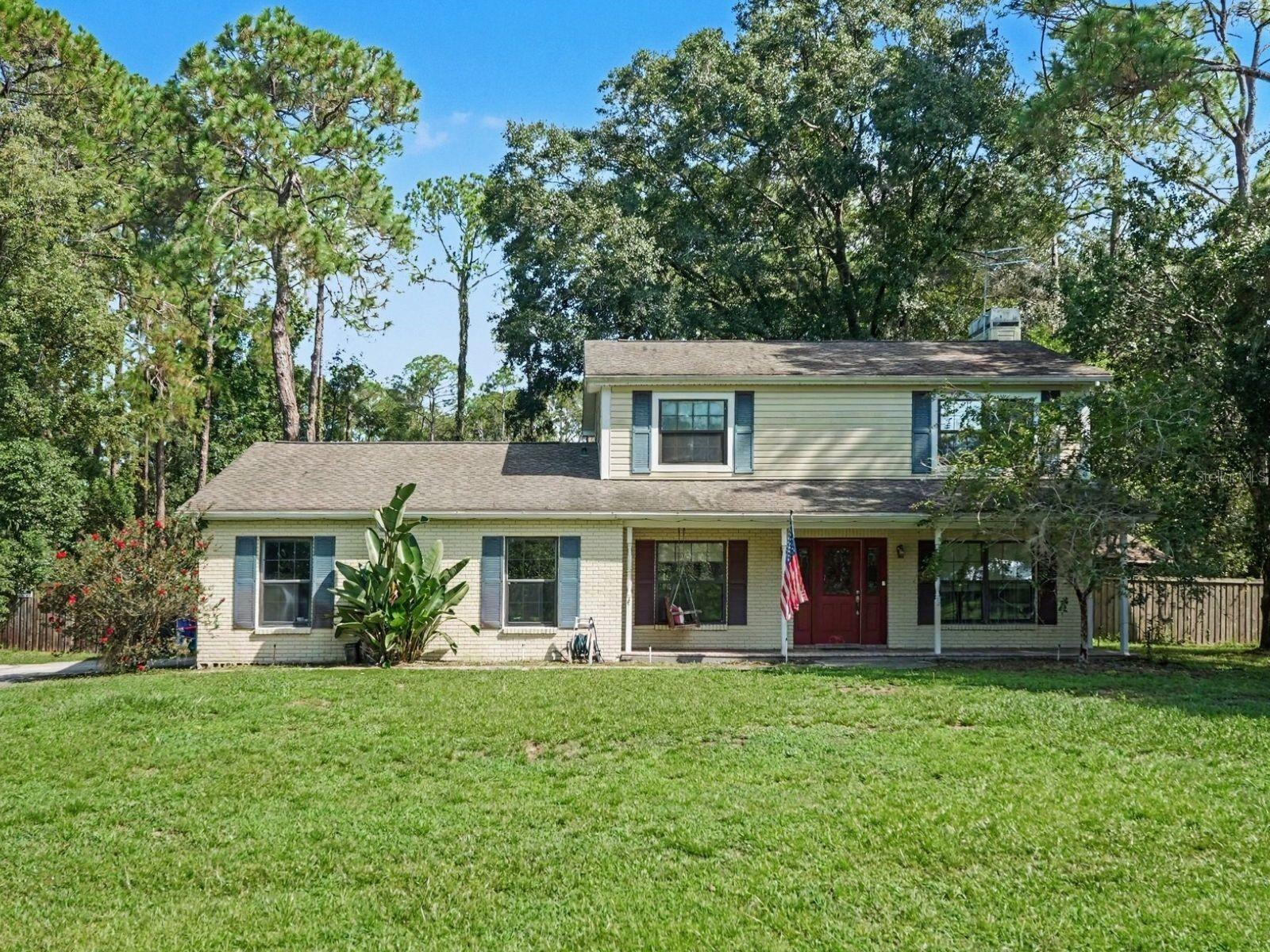 Virtually Staged. If you are looking for a home with country charm but not far from everything, this is the one. Sitting on just over an acre and surrounded by mature trees, you'll enjoy your own slice of country in the huge backyard complete with your own gazebo and two-stall horse barn complete with electrical and a hose for rinsing off. Step through the front door and into this two story home offering a modern kitchen with white shaker cabinets, granite countertops, and a stainless steel appliance package. Laminate flooring flows through the downstairs from the living room, formal dining room, family room and kitchen. Upstairs, all three bedrooms have carpet to help keep sound to a minimum and two bedrooms are connected by a Jack and Jill bathroom. The large primary bedroom features double doors and an ensuite bathroom with a double vanity and his and hers closets. Just minutes from The Grove at Wesley Chapel, the new Hub at Lexington, I-75, groceries, restaurants and more. This location cannot be beat!