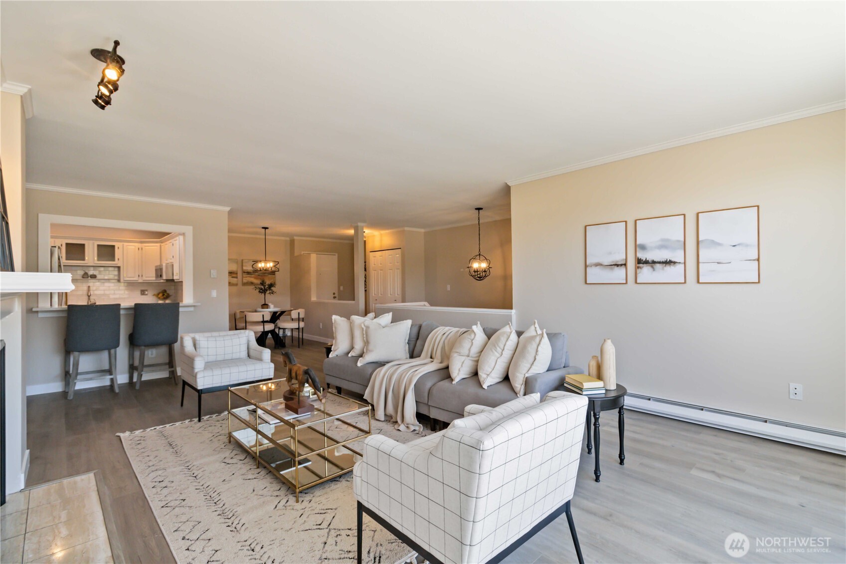 Turnkey Top-Floor Condo in the Heart of Mercer Island is move-in ready. This remodeled home offers a prime location just steps from the Farmers Market, parks, shops, and dining. The open-concept main level boasts new luxury flooring, fireplace, and a modernized kitchen with premium appliances and new quartz countertops. The west-facing deck delivers stunning sunset and city views.The lower level features a tranquil primary suite with an ensuite bath and a private balcony, along with a second bedroom, another updated full bath, and a versatile flex space perfect for a home office, gym, or creative studio. In-unit laundry completes the layout. Located in a secure, well-maintained building with an elevator and two dedicated parking spaces.