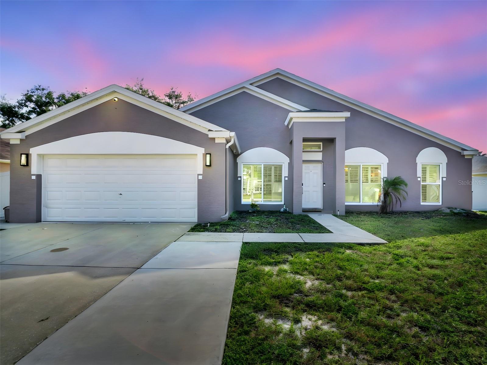 Welcome to this beautifully updated and truly move-in ready 4-bedroom, 2-bath home in the highly desirable Brittany Park neighborhood of Tarpon Springs. Renovated from top to bottom, this spacious residence combines modern design, comfort, and timeless appeal.

The heart of the home is the stunning new kitchen, designed with both style and functionality in mind. It features a center island with striking waterfall granite countertops, sleek cabinetry, and high-end finishes that make it the perfect gathering place for family and friends. Both bathrooms have been fully remodeled with a contemporary touch, while brand-new tile flooring flows seamlessly throughout the entire home, tying each space together.

With soaring ceilings, an open-concept layout, and abundant natural light, the living areas feel bright and airy. The thoughtful split floor plan provides privacy for the primary suite, and custom closet built-ins add convenience and organization. Every detail has been carefully considered to create a home that is both elegant and livable.

Step outside to enjoy a spacious, fenced backyard—ideal for hosting barbecues, letting pets play, or simply relaxing under the Florida sun. The large lot offers plenty of room for future personalization, whether that means adding a pool, creating a garden, or designing the outdoor space of your dreams.

This home is not only beautiful but also practical—situated in a no-flood zone, giving you peace of mind. The location is hard to beat: just minutes from the world-famous Sponge Docks, the scenic Pinellas Trail, Anclote River Parks, and the vibrant downtown district of Tarpon Springs. Here, you can enjoy boutique shopping, dining, concerts, and the popular First Friday events. Nearby beaches, including Fred Howard Park with its sandy shores and causeway, make it easy to embrace the outdoor Florida lifestyle.

Named USA Today’s #1 Small Historic Town in the Nation, Tarpon Springs offers a unique blend of charm, culture, and coastal living. This home presents the perfect opportunity to settle into a welcoming community while enjoying the comfort of a fully renovated property. Don’t miss your chance to make this stunning home your own!