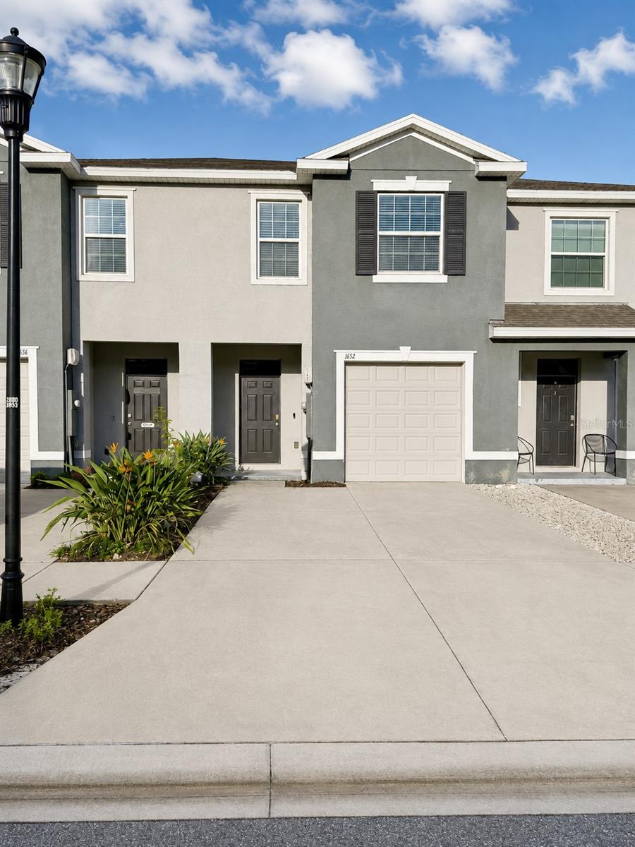 3-bedroom, 2.5-bath townhome offering comfortable living space in the desirable Union Park community. This home features a bright, open-concept floor plan ideal for everyday living and entertaining.Granite countertops, stainless-steel appliances, a breakfast bar, and abundant counter space. Upstairs, the spacious primary suite includes a private bathroom and generous closet space, with two additional bedrooms providing flexibility for family, guests, or a home office. Enjoy Florida living plus the convenience of an attached one-car garage. Union Park offers resort-style pools, a splash pad, clubhouse, fitness facilities, playgrounds, scenic lakes, and miles of walking and biking trails. Conveniently located near shopping, dining, hospitals, major roadways, Tampa Premium Outlets, and The Shops at Wiregrass.