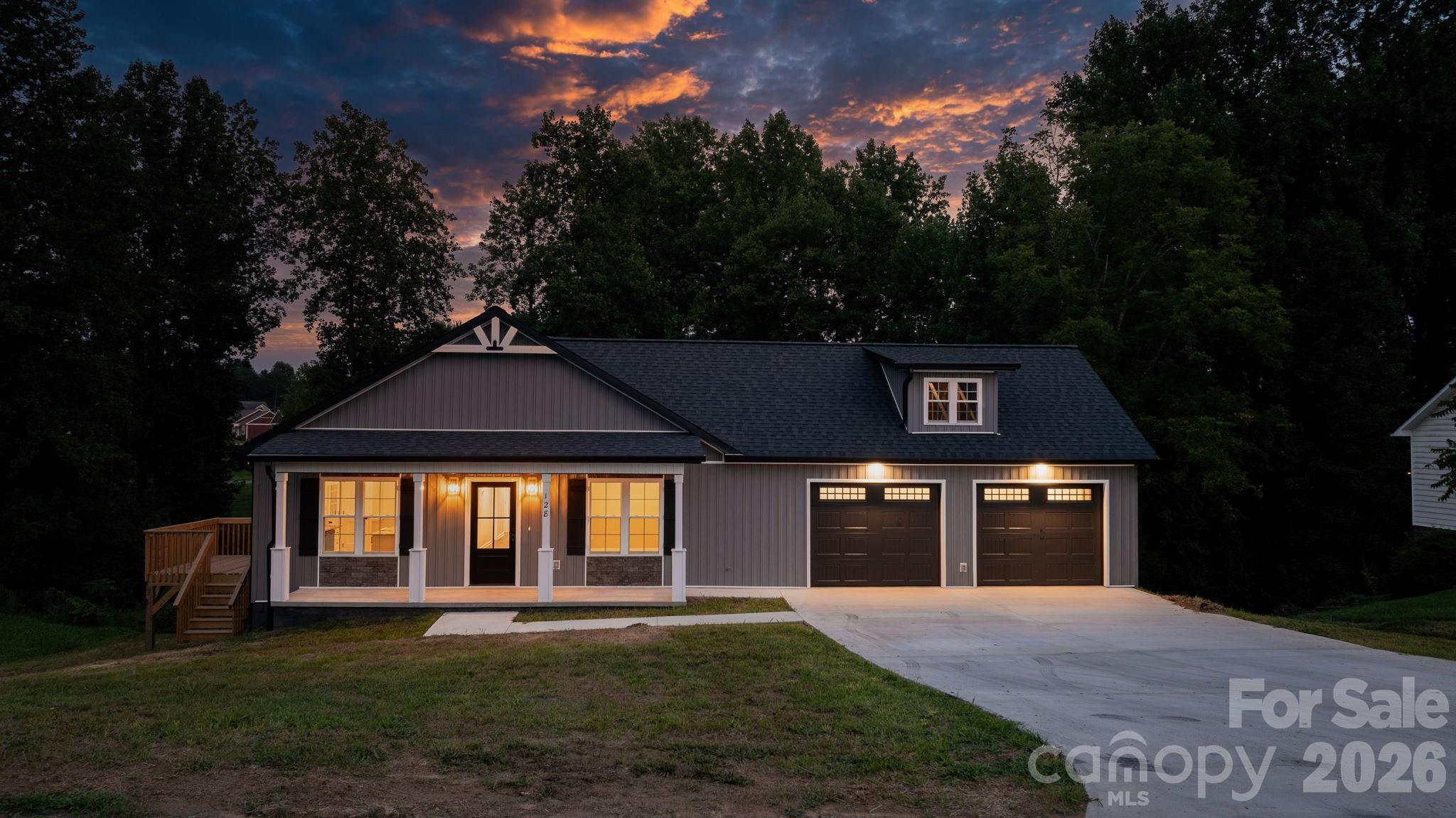 NEW CONSTRUCTION in the desirable Deer Creek subdivision! This beautiful new 3BR/2BA home offers an inviting open floor plan, modern finishes, and plenty of room to grow. Luxury vinyl plank flooring provides a sleek, clean look, while cathedral ceilings create an open and spacious feel. The light and airy kitchen features crisp white cabinetry, granite countertops, stainless steel appliances, and a large island. The kitchen and dining area open directly onto the side deck, making outdoor dining and entertaining easy and enjoyable.The spacious primary suite features a large walk-in shower and walk-in closet. The full unfinished basement offers tons of storage and endless possibilities for future expansion. Need even more space? No problem! This home also features TWO attic rooms with walk-up access, providing additional storage or potential bonus space.Convenience is key with an oversized main-level garage and zero-step entry at the front door. Located in a desirable school district and conveniently close to Hwy 321, shopping, dining, and everyday amenities.Brand new, spacious, and loaded with possibilities—come see why this Deer Creek home is the one you've been waiting for!