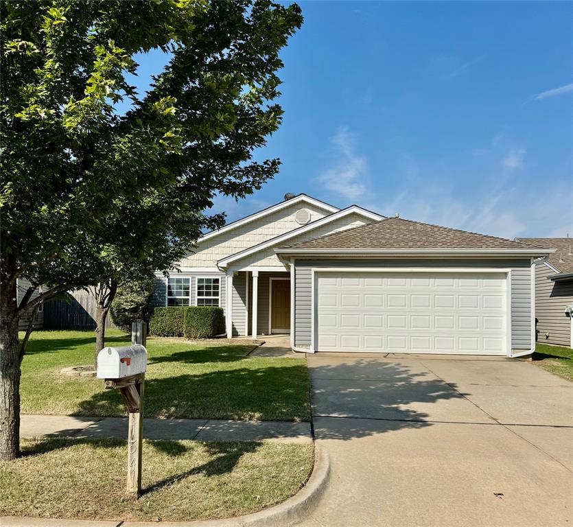 Welcome to this charming 3-bedroom, 2-bathroom home filled with natural light and easy-living features! Step inside to find laminate wood floors flowing throughout the home, creating a warm and cohesive feel. The spacious living room offers soaring ceilings, a ceiling fan, and plenty of room for gathering.

The kitchen is designed for both function and style, complete with an eat-at bar top, smooth-top cooking range, built-in microwave, and a convenient storage pantry. Just off the kitchen, the sizable dining area is the perfect spot for a round table, with extra room for storage or display pieces.

The primary suite features a full bathroom and a large walk-in closet. Two secondary bedrooms, also finished with laminate wood floors, share access to a nearby guest bathroom. A separate laundry room adds convenience, and the attached 2-car garage provides plenty of parking and storage.

This inviting home combines comfort, practicality, and charm—ready for its next owner! Call today to schedule a showing.