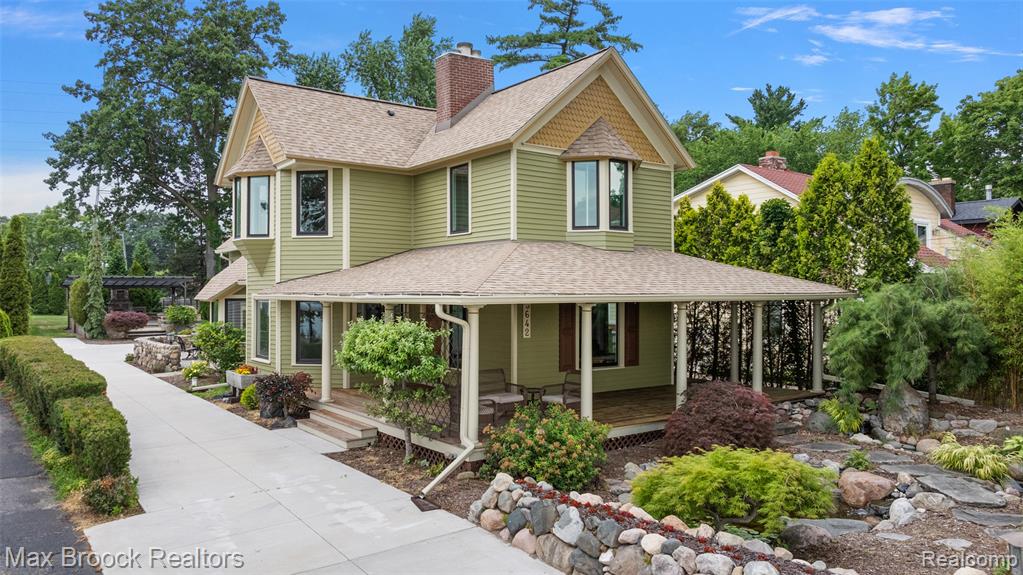 Discover the beauty, recreation, and charm of Pine Lake living, where fun and relaxation are just steps from your front door. From the moment you arrive, you're greeted by a wraparound front porch with fabulous lake views, lush landscaping, and a tranquil water feature. Spend sun-drenched days lounging by the water on your private dock, perfect for morning coffee or simply soaking up the views. Or step aboard your boat for a cruise around the exclusive, private waters of beautiful Pine Lake, reserved solely for property owners, with no public boat launches. Inside, the living room offers a welcoming space, sharing a dual-sided fireplace with the generously sized dining area. The kitchen features custom cabinetry, stone countertops, and a cozy breakfast nook that opens to one of two stunning patio spaces. Upstairs, the spacious primary suite includes a fireplace and picturesque lake views. Two additional ensuite bedrooms offer comfort and convenience for family or guests. A versatile flex room is perfect for a home office, gym, or media space. An elevated stone paver patio, crafted from premium materials, and boasting a beautiful wood burning fireplace adds another outdoor area to relax or entertain. The deep, private backyard provides direct access to the W. Bloomfield walking trail. With so many inviting spaces to unwind or host, this home is a true gem, offering the very best of lakefront living. Please see the attached feature sheet for more information.