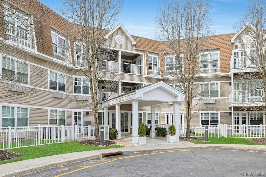 Enjoy a carefree, low-maintenance lifestyle in this well-maintained 3rd-floor condo located in a vibrant 55+ community (at least one resident must be 55+). Designed for comfort and convenience, the building offers desirable amenities including a well-equipped gym, a stylish resident lounge, an elevator, and secure garage parking. The inviting unit features a spacious primary bedroom with new carpet, an en-suite bath and walk-in closets, as well as a generously sized second bedroom also featuring brand new carpet. Oversized windows allow for abundant natural light throughout the condo. In-unit laundry adds everyday ease, while the private balcony provides a perfect spot to relax. Heat and hot water are included in the HOA fee, and the building is equipped with a backup generator. Conveniently located just minutes from shopping, dining, medical offices, and everyday essentials, everything you need is right at your fingertips. This condo delivers the ideal blend of comfort, convenience, and amenities—move in and start enjoying stress-free living today.