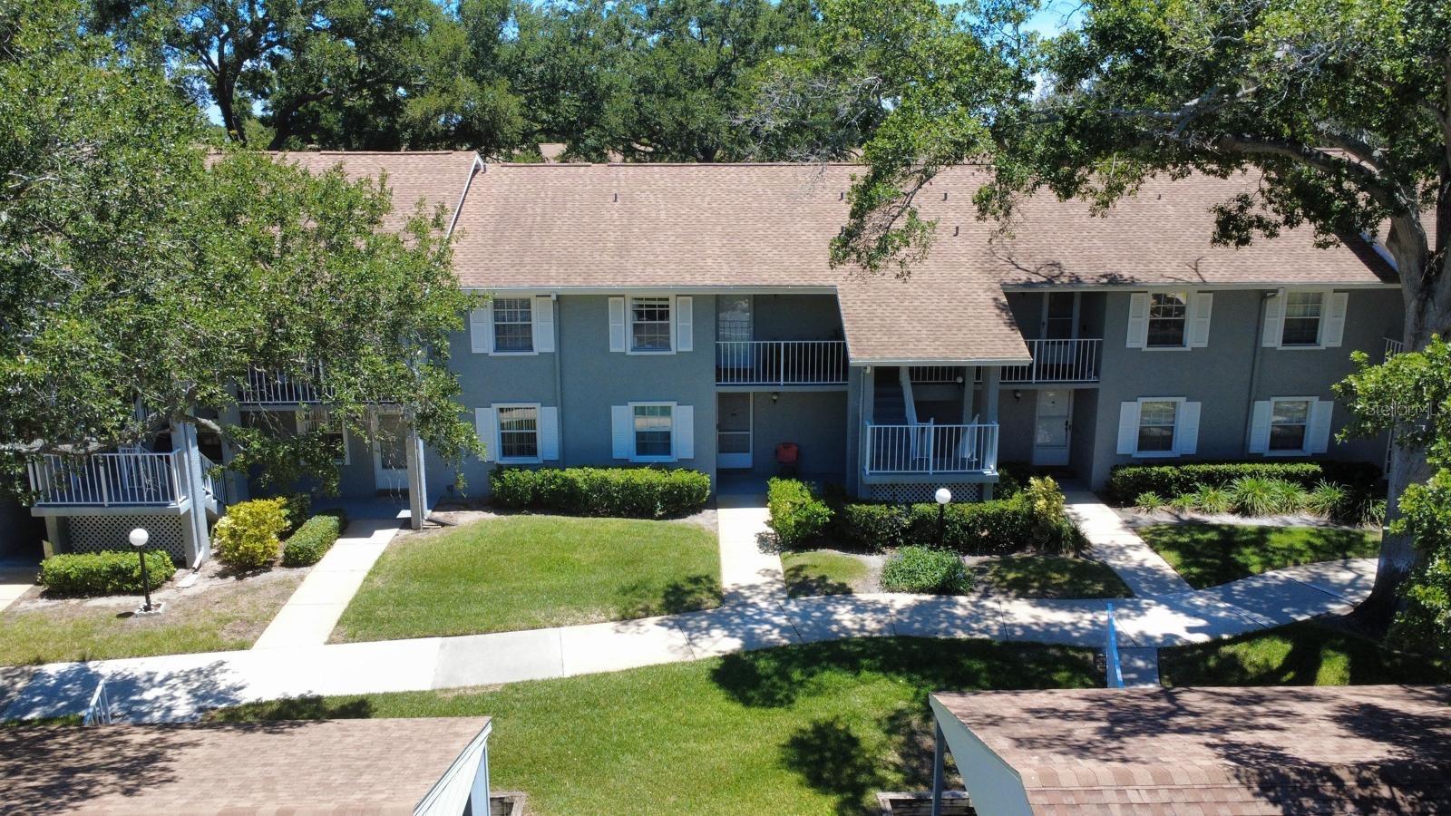 Welcome to this beautifully updated 2-bedroom, 2-bath condo located in the highly desirable Lake Tiffany community of Dunedin. This light and bright residence features a spacious open layout with vaulted ceilings, modern finishes, and durable flooring throughout. The updated kitchen offers a clean, functional design perfect for everyday living, while the split bedroom layout provides privacy and comfort.Enjoy peaceful Florida living with a screened-in porch area ideal for morning coffee or relaxing evenings overlooking the lush, well-maintained landscaping. The unit also includes convenient in-unit laundry, generous closet space, and an assigned covered carport.Lake Tiffany offers resort-style amenities including a sparkling community pool with cabana, beautifully maintained green spaces, walking paths, and a quiet, pet-friendly environment. The HOA provides exterior maintenance, cable/internet, and community upkeep, making ownership simple and low-stress.Perfectly located just minutes from charming Downtown Dunedin, residents can enjoy local restaurants, boutique shops, farmers markets, and waterfront parks. Nearby attractions include Honeymoon Island State Park, Caladesi Island, the Pinellas Trail, and Clearwater Beach, offering some of the best coastal lifestyle experiences in Florida.Whether as a primary residence, seasonal retreat, or investment opportunity, this condo delivers comfort, convenience, and an unbeatable Dunedin location.