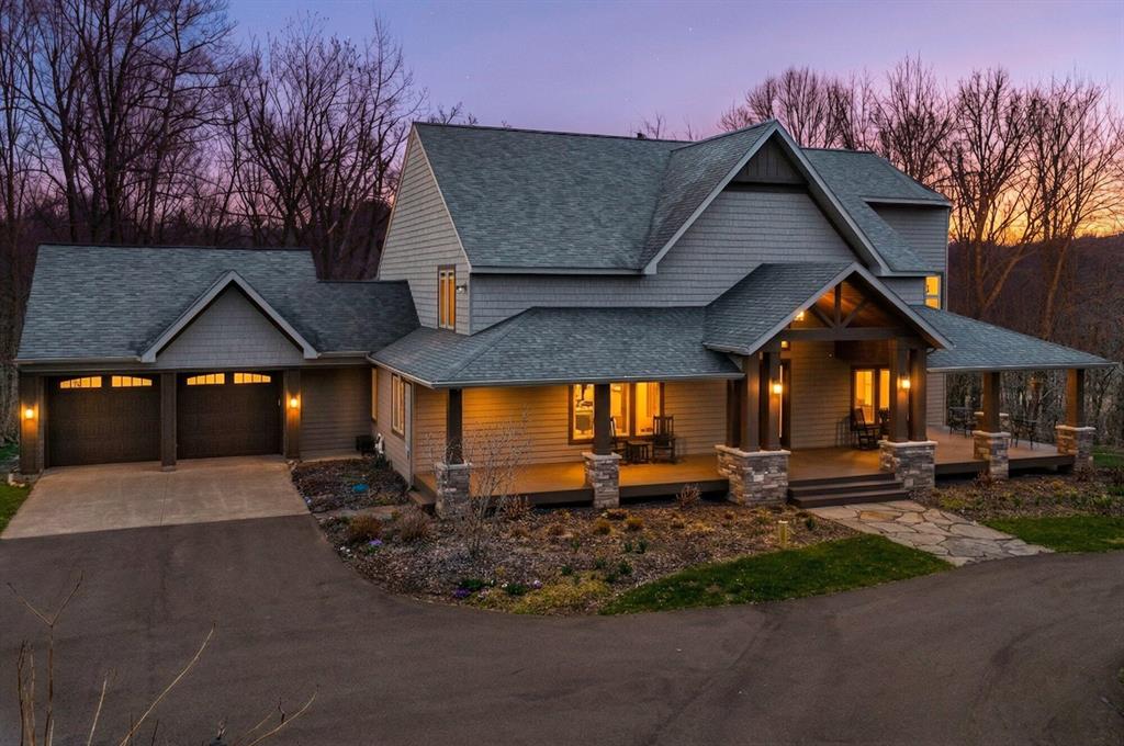 There are properties that offer space-and then there are places that offer something far more rare: a way of living. This exceptional sprawling estate spans over a mile in depth on 62.79 acres. It features a main level primary bedroom with spa like bath, eat in kitchen with stainless appliances, cozy nook and loads of nature light, living area with fireplace and vaulted ceilings, two additional spacious bedrooms and an open loft. The lower level features a theater room unlike anything you've ever seen, with 144' screen and A Dolby Atmos system with premium Klipsch speakers, and reclining theater seating. This is an experience that must be seen and felt to be appreciated. For more fun and entertaining-visit the extraordinary bar/lounge that is just steps from the front door. Complete with commercial fridge, poker table, retro video game (500 games) and all bar signage and lighting. This fantasy property has been curated over years, and operates turn key. The property is an equestriandream, with miles of riding trails, meandering creek, and mature hardwoods make this the ultimate outdoor paradise. Nature envelops you on the back deck and offers a level of serenity and privacy unmatched by any other property. In addition to the deck, the fire pit offers another gathering place. There are 3 total parcels included totaling 62.79 ares. Outbuilding sizes are 30x40 (the lounge), 24x30 horse barn with power and water, and  24x40 equipment barn with concrete floor and tack room. The property on Shaytown Rd. (37.84 acres) has approx 25 tillable acres, plus grassland, woods and a 32x48 pole barn with two overhead doors, concrete and 8' overhang to enjoy sunsets. The story of this property cannot be captured in an MLS write up and must be experienced to appreciate. Several furnishings are remaining with the home, including all theater belongings and bar/lounge signage and equipment. This storybook estate offers privacy and a lifestyle that you will not want to leave.