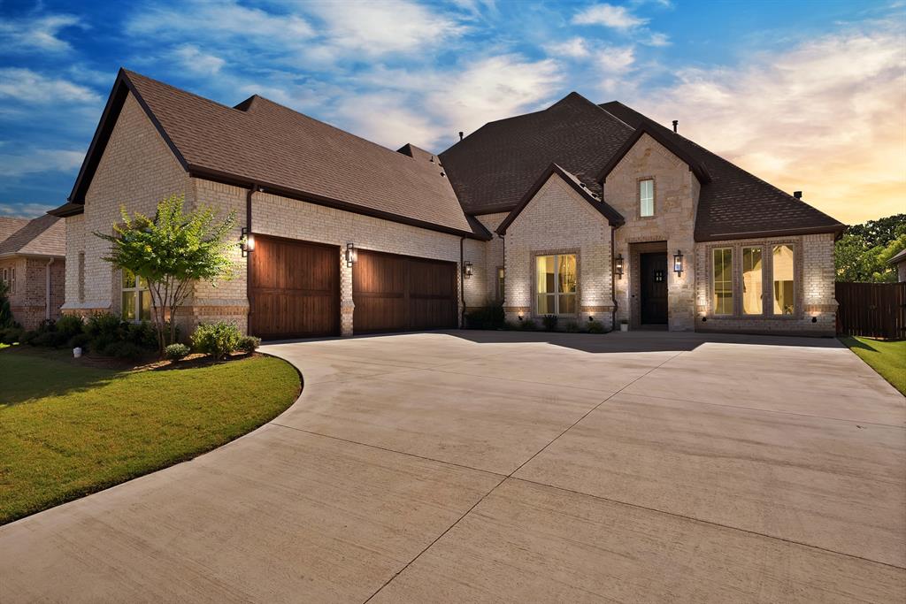 Welcome to your exquisite like-new Custom Home by Boyd Builders, Inc. Located in the private and gated community of Harris Place, within the highly sought-after Mansfield ISD! Situated on over a third of an acre, your meticulously designed residence offers unparalleled tranquility and stunning natural surroundings, making it the ideal place for your family to call home. Experience luxury living at its finest, where every detail has been carefully curated to offer both elegance and comfort in a private gated community. This spacious residence features 4 bedrooms with a choice of a 5th bedroom or an Office, 3 full baths, and 1 half bath, providing ample space for gatherings and relaxation. The spacious living room is the heart of the home, featuring an open concept living plan and a beautiful electric fireplace with gas logs. In the Gourmet Chef's kitchen, complete with a massive island, you’ll find a gas cooktop, double ovens, quartz countertops, and custom cabinetry. The Primary Suite is a retreat unto itself, showcasing a lavish En-Suite bathroom, offering a soaking tub, separate vanities, and a gratuitously generous walk-in closet.This home includes a formal dining area, and a Game or Media room, ensuring ample space for all of your needs. Hand scraped hardwood floors are another amazing feature throughout the home, and the Cedar Garage Doors add a classic touch to the exterior. Step outside and enjoy the oversized covered patio, perfect for relaxing or entertaining during any season. With a peaceful greenbelt directly behind the home, you’ll have added privacy, enhancing the outdoor living experience. This home is conveniently located near shopping, dining, and easy highway access, and perfectly situated right in between Fort Worth and Dallas. Don't wait to make this beautiful house YOUR NEW HOME!