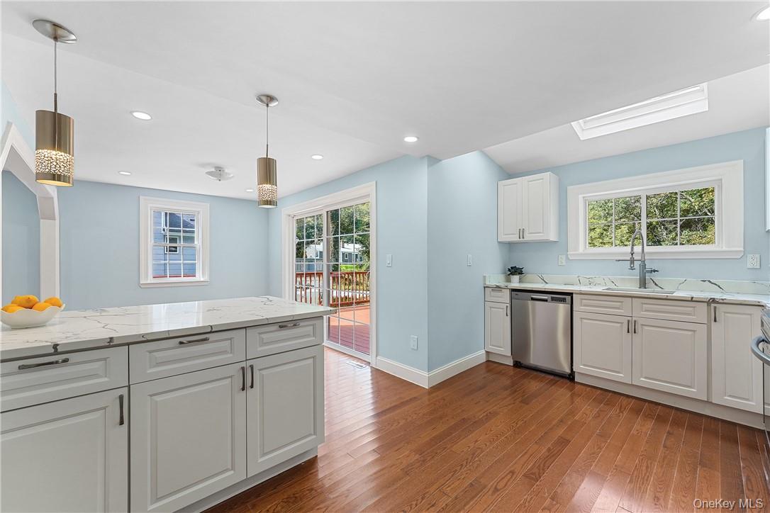 Move right in to this renovated farmhouse colonial. The new kitchen with quartz countertops, spacious island and stainless appliances is open to the dining area with door to deck and flows into the living room. Step down to a large family room with fireplace and new full bathroom. Upstairs is a newly renovated bathroom with walk in shower and two bedrooms, one with a walk-in cedar closet. The lower level offers plenty of additional space with storage area, laundry, utilities, and door to yard. The property is located very close to Armonk town and offers a great front porch, spacious deck and flat yard. Byram Hills Schools.