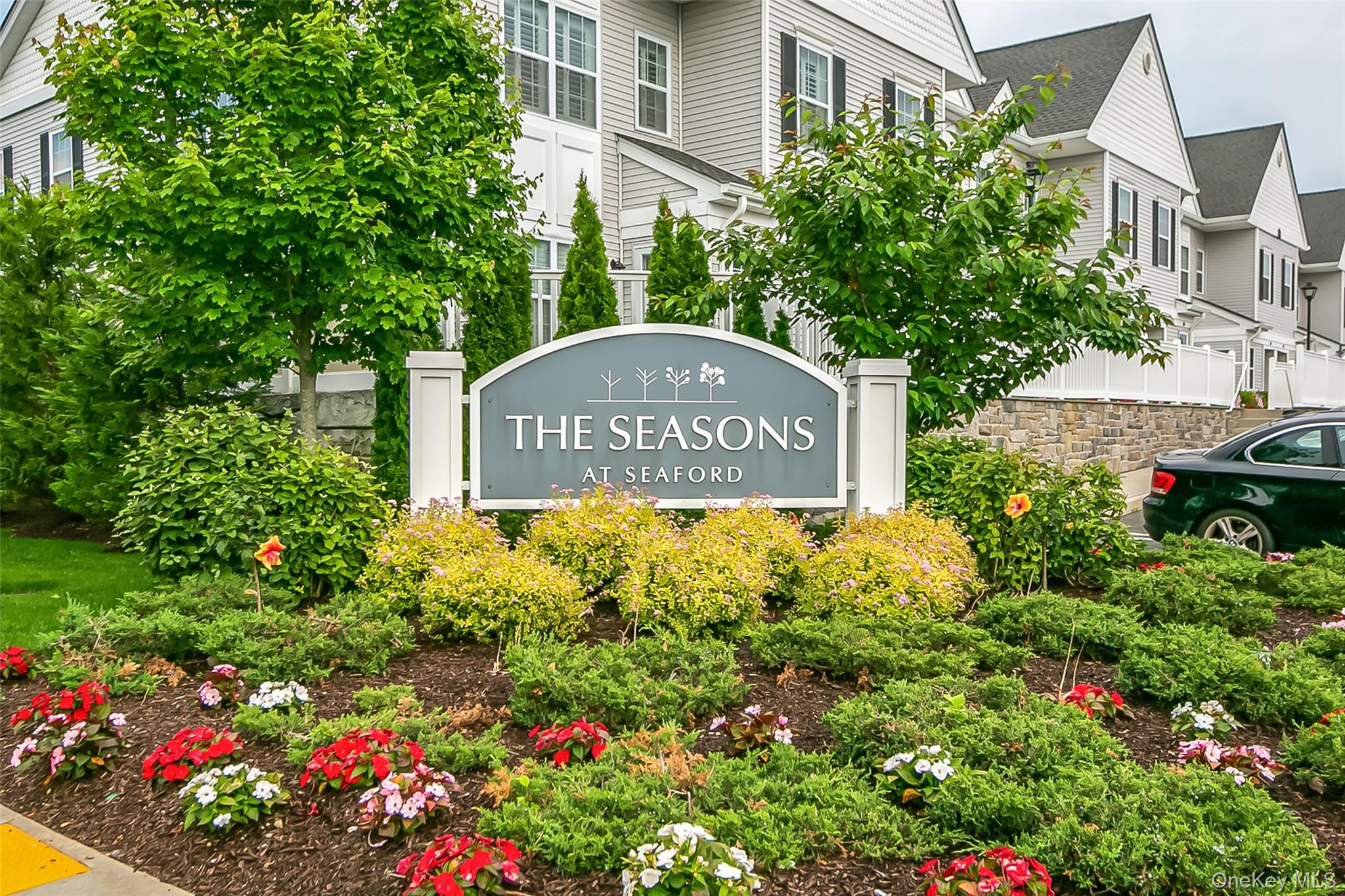 Have you been waiting for a ground-floor unit at The Seasons of Seaford? This is your opportunity to own the original MODEL UNIT, complete with every upgrade and luxury feature.  This absolutely stunning home stands out from the rest. In addition to the standard two-bedroom, two-bath layout, it features high ceilings with elegant crown moldings, recessed lighting, an open-concept kitchen with a marble backsplash, and gleaming hardwood floors.  The beautifully finished basement doubles your living space, offering an additional half bath, detailed wainscoting, and an entertainer’s dream bar with built-in cabinetry and granite countertops.  Every available upgrade is included. All of this is ideally situated in a prime location, featuring a private patio overlooking the pool.  The Seasons of Seaford, a 62+ community, offers resort-style living at its finest.