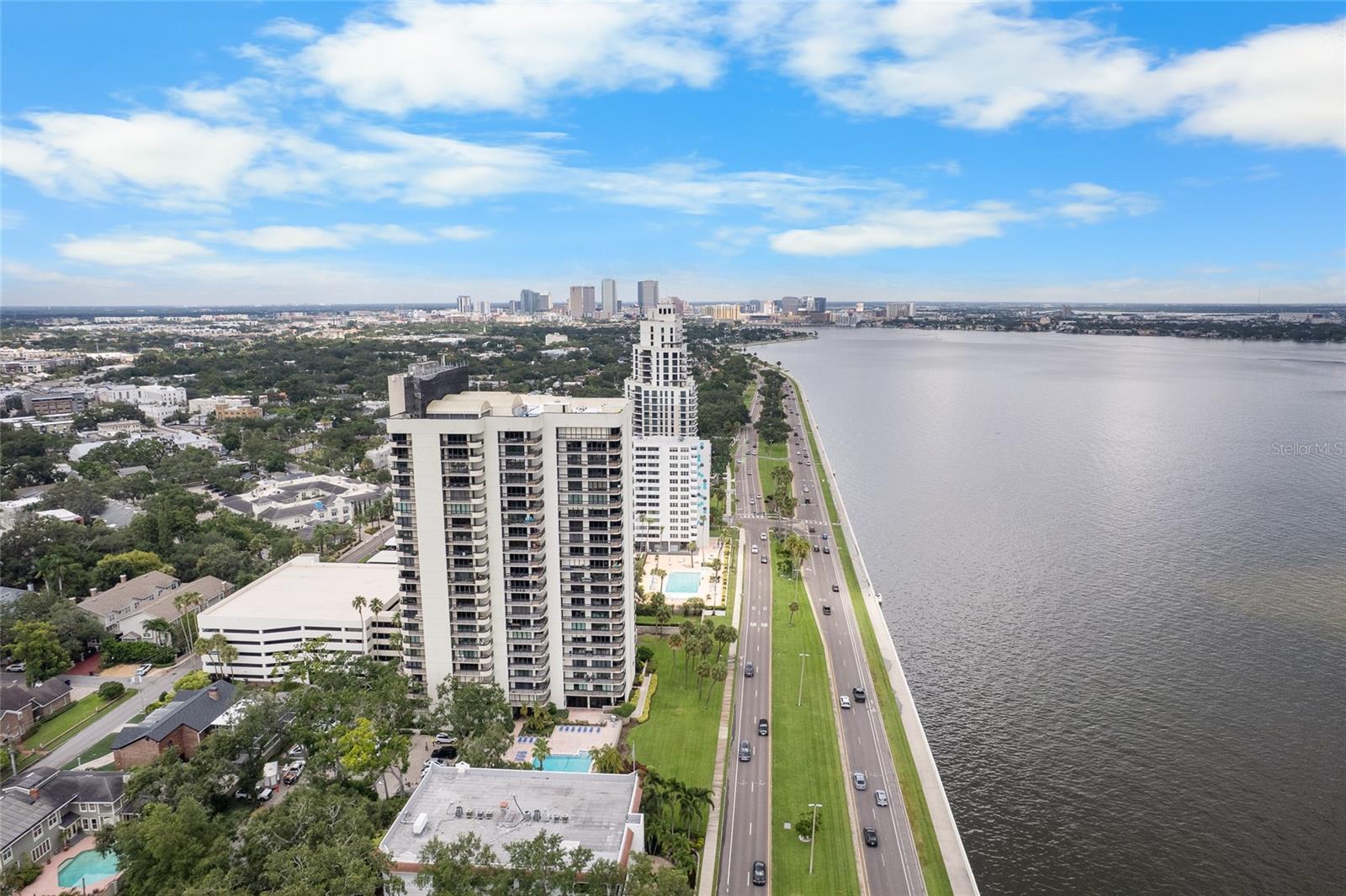 Prime location at the corner of Bayshore Boulevard and South Howard Avenue—this 2-bedroom, 2-bathroom, 1,376 sq ft condo offers unmatched access to Tampa’s best dining, shopping, and recreation. Situated on the 8th floor with stunning bay views, this thoughtfully designed corner unit features two private balconies and expansive floor-to-ceiling sliding glass doors that flood the space with natural light.

As the only unit on its side of the floor, privacy and convenience are unmatched—simply step off the elevator, turn right, and you’re home. The primary suite includes its own balcony, generous closet space, and a private en-suite bathroom. The open-concept living and dining area flows seamlessly, perfect for entertaining, and connects directly to the main bay-view balcony.

The kitchen has stainless steel appliances, granite countertops, a wine refrigerator, and its own sliding door leading to the balcony—ideal for enjoying a morning coffee with a breeze off the bay. The secondary bedroom is tucked away and overlooks the Atrium’s stunning interior courtyard, with a full bath just steps away. A spacious in-unit laundry room adds convenience and bonus storage.

Located just minutes from Hyde Park Village, Water Street, Sparkman Wharf, Downtown Tampa, and Tampa General Hospital, this residence offers the perfect blend of tranquil waterfront living and vibrant city life. The Atrium offers 24/7 front desk security, heated pool and spa with bay views, fitness center, club room with library, and rooftop tennis courts (being redone, likely adding pickleball courts too). Don’t miss the opportunity to own this rare gem—schedule your private showing today and experience the best of Bayshore living! MILESTONE STUDY DONE, ALL ASSESSMENTS PAID OFF!