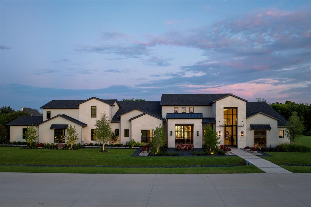 Crafted for connoisseurs of design and comfort, this exceptional home offers a lifestyle of refined luxury. From the moment you enter, you’re enveloped by exquisite materials—wide-plank white oak flooring, dramatic quartzite countertops, artisan marble tile, and sophisticated champagne brass accents—all selected with intention and precision. A seamless open layout and Control4 smart-tech invites effortless entertaining. The stunning kitchen is equipped with Thermador appliances, an elegant wine room, and a concealed prep kitchen that opens to the fully outfitted outdoor kitchen. Oversized sliding doors in both the great room and media room reveal a resort-style backyard with expansive covered patio, sleek pool, and a cozy fireplace—perfect for year-round indoor-outdoor living. One of the home’s most exclusive features is the dedicated cigar lounge, a haven complete with a walk-in humidor, built-in espresso machine, sink, built in refrigerator, and its own separate HVAC system to ensure comfort and climate control. The primary suite is a retreat unto itself with a private exercise room, spa-like bath, and a boutique-style custom closet with direct access to the laundry room. Every secondary bedroom offers en-suite privacy, and guests will appreciate two impeccably designed powder baths. A handsome study offers a hidden workroom and concealed closet, blending function with elegance. The immaculate theater room is designed for elevated entertaining, complete with a full wet bar, built-ins, and wine fridge, —opening seamlessly to the outdoor deck. The expansive game room creates the perfect space for playful moments. For the automotive enthusiast, the oversized 4-car garage is a true showpiece, featuring custom showroom-style epoxy flooring with dramatic metallic gold and jet-black marbling. Located minutes from 75 and 121 for effortless access across the Metroplex, this home feels worlds away—offering privacy, luxury, and inspired living at every turn.
