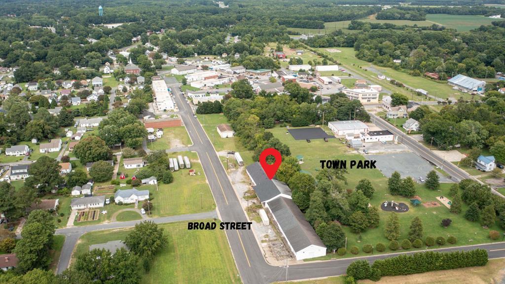**Motivated Seller** Here is your opportunity to own this versatile commercial property, featuring over 15,000 square feet of SOLID warehouse space and an additional 1,200+ square feet of office space and multiple loading docks. Situated just off Lankford Highway, this property has a rich history, having served as a packing facility for over 50 years and more recently as a recreational batting facility, with recent upgrades to the roof and electrical system and connected to the town sewer, this property offers a seamless transition to your next venture. Whether you're envisioning a brewery, a new packing facility, or any other enterprise, this space is ready to accommodate your needs.