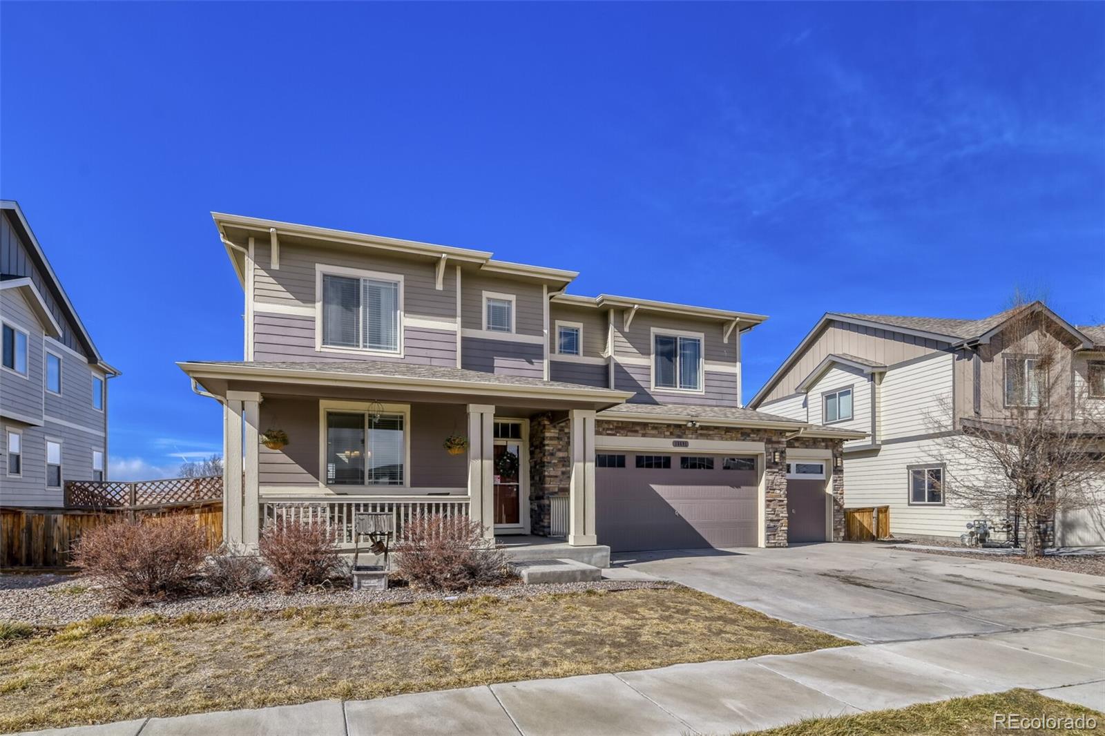 This beautifully updated 2-story in The Village features 5 bedroom (3 upper / 2 bsmt conforming), 3.5 baths, main floor dining, kitchen, living room, finished basement (family room, beds, bath) and a 3 car garage.  Meticulously maintained - pride of ownership shines throughout.  Backing to open space & canal with great mountain views. Gorgeous updates including slab granite counters & island, stainless steel appliances (gas range), tile accents and more. The many windows throughout allow the natural light to cascade in - bright and cheerful. Central air, furnace, gas fireplace and ceiling fans keep this home comfortable all year long. The finished basement is perfect for guests or that teen wanting their own space.  This home lives large. Exterior features include a covered patio, covered upper deck (w/ceiling fan), covered front porch and a fenced & landscaped yard overlooking a greenbelt / open space area - great for relaxing after a long day or people watching from the front.  A detached shed in the rear offers ample storage. It is easy to picture yourself calling this one yours.  Close to dining, shopping, entertainment and other amenities. Just minutes from Buffalo Run Golf Course. Don't miss your opportunity. Welcome Home!