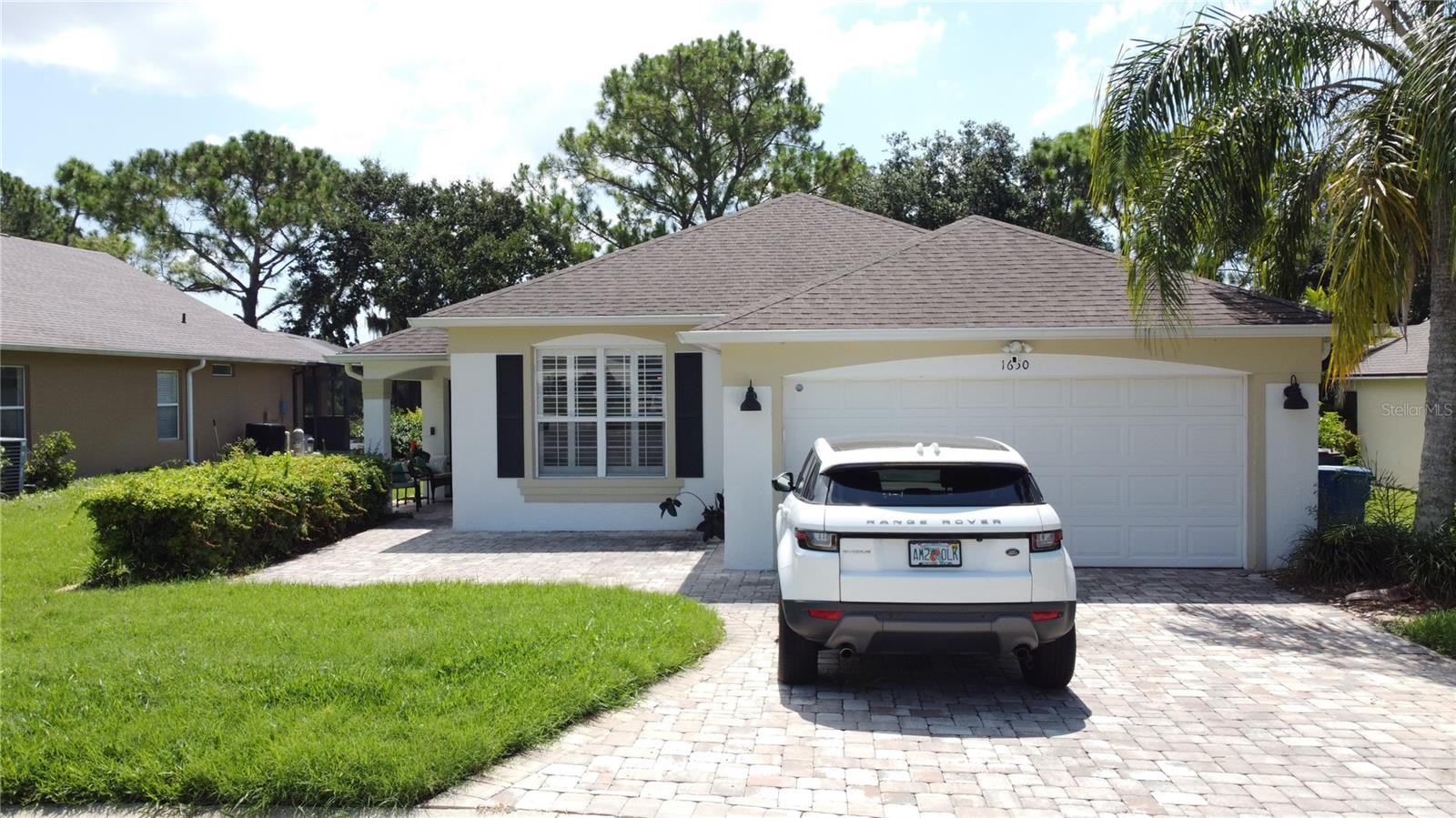 Stop the golf cart… this is the one! Simply stunning 4-bedroom, 3-bathroom pool home with breathtaking golf course views, ideally tucked away in a quiet cul-de-sac on the 12th fairway of the sought-after gated community of Southern Dunes Golf & Country Club. Offered furnished for convenience, whether you're searching for a primary residence, winter retreat, or income-producing vacation home, this beautifully updated property offers space, style, and scenery in equal measure.  As you drive up you will notice the paver driveway and mature landscaping. Step inside to a warm and elegant open-concept living space that flows effortlessly into the kitchen and dining areas — all overlooking the screened pool and lush fairway beyond. The heart of the home is the beautifully remodelled kitchen, featuring rich cherry cabinetry, a generous central island with gleaming granite counters, newer appliances, upgraded lighting, and an eye-catching backsplash. It’s the perfect place to gather, cook, and entertain Florida-style.  The desirable Laguna floor plan includes two en suite bedrooms at the front of the home, ideal for guests or multi-generational living, along with two additional bedrooms and a third full bath. Elegant window shutters and upgraded patio doors add to the sense of quality throughout. NO CARPET - Neutral tile throughout for easy maintenance.  Outside, the pool deck becomes your private oasis. Enjoy morning coffee under the lanai, soak up the sun on the spacious deck, or relax in the evening with a glass of wine while taking in the ever-changing views of the 12th fairway. With a covered sitting area, screened enclosure, and plenty of room to dine, lounge or even watch your favorite show on the TV, it’s a space you’ll love year-round.  Southern Dunes offers 24-hour security, a top-rated golf course, clubhouse, tennis courts, fitness center, and a newly added flood-lit driving range. Zoned for short-term rental and perfectly located near Posner Park, I-4, theme parks, medical facilities, and dining, this is Florida living at its best.  Don't miss this one-of-a-kind opportunity — schedule your private showing today.