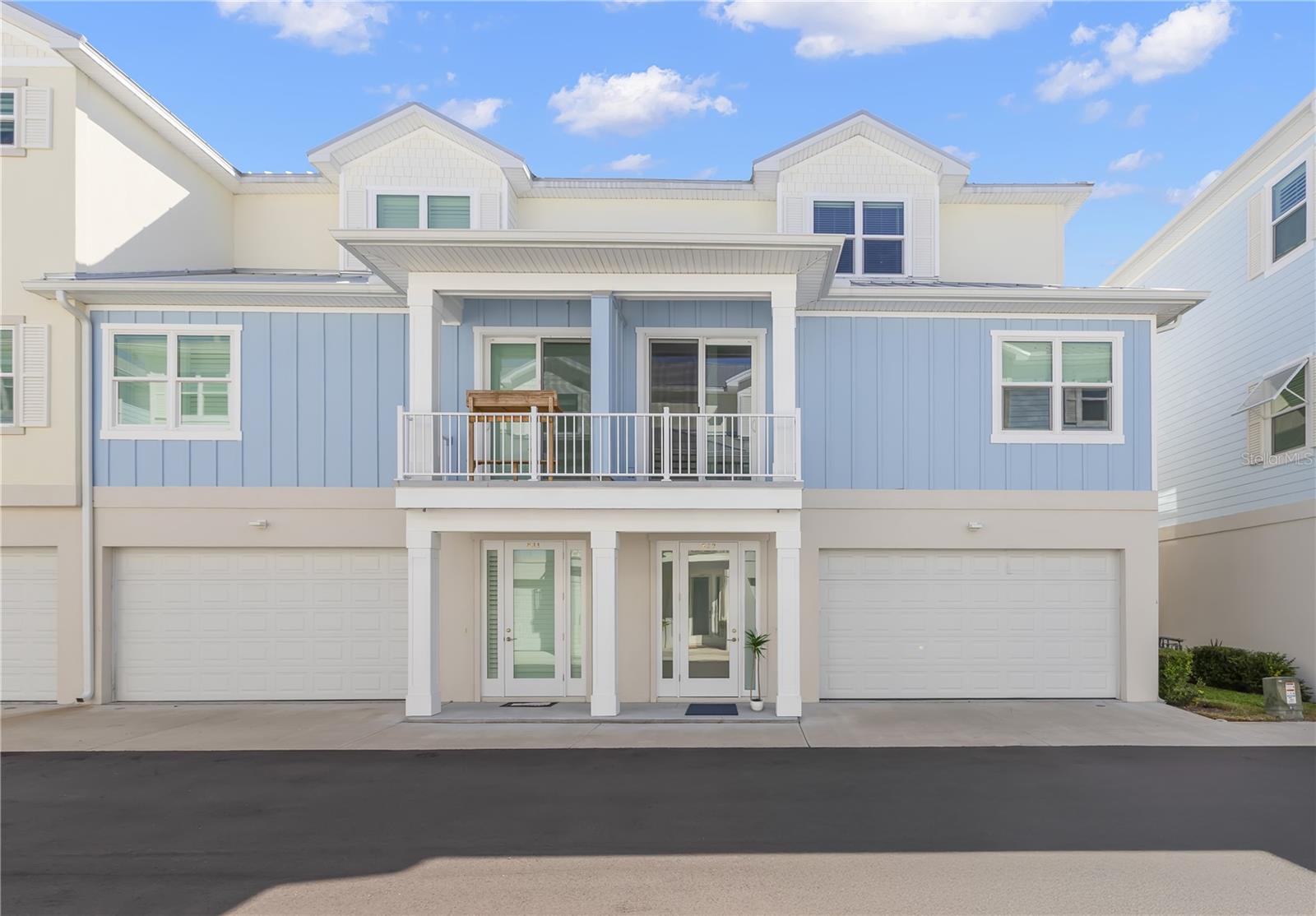 One or more photo(s) has been virtually staged. Luxury living in Downtown Dunedin can be yours today! This beautiful new townhome, built in 2023, is walkable to all the shops, restaurants, and scenery that downtown has to offer. It is the perfect home for owning a golf cart, as you have many places to drive it, and an oversized, tandem, 4-car garage for storing it. The finishes inside are stunning. Engineered hardwood flooring runs throughout the entire home, giving an updated and cohesive look. The ground level consists of your garage, back covered patio, entry, and large storage closet under the stairs. There is also an ELEVATOR that goes to all levels of the home for ease and convenience. The second floor is your main living area and is sure to impress. The large, open kitchen features 42” cabinets, quartz countertops, a marble backsplash, stainless steel appliances, a large apron sink, a grand island, custom lighting, and a pantry with room to spare. You’ll also find that there are high ceilings throughout and plenty of natural light, making it feel even more spacious and airy. On the second floor there is also a full bathroom, a bedroom, and a sizable laundry room with a utility sink. The top floor is where you’ll find the primary suite, third bedroom, and third full bathroom. The primary ensuite is designed with marble and stone-look tile for a spa feel, quartz counters, a large vanity with ample storage, double sinks, a walk-in shower, and a water closet. It also has a great walk-in closet with space for both partners! Other special touches include custom feature walls, high end hardware on all cabinets, chic and unique new bathroom fixtures, and sophisticated picture lights and sconces. The home’s construction really makes it stand out from other new construction homes in the area. These townhomes are built with insulated concrete forms (ICF), meaning this home is extra sturdy, wind resistant, termite and pest resistant, mold resistant, and sound insulated. Other notable features include energy efficient, impact windows and sliding doors, a metal roof, resource efficient appliances, and NATURAL GAS, saving you big money on your power bill. The community HOA fees are low at only $265 per month. Coming soon – a brand-new community POOL! Construction is starting the week of 10/6. This exclusive community of only 32 townhomes is just a short walk to downtown and the Pinellas Trail. A quick trip to the Dunedin Causeway, Honeymoon Island, local parks, and Clearwater Beach. Come see this standout home today!