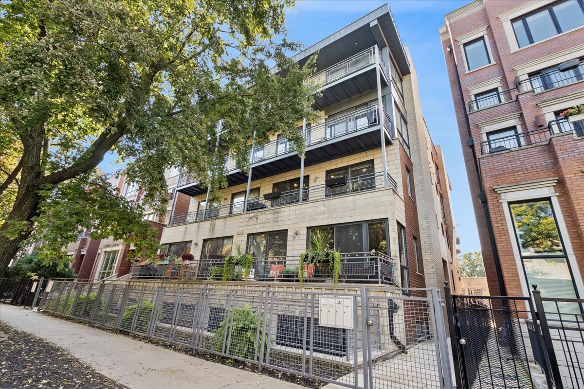 Check out this stunning 2-bedroom, 2-bathroom extra wide condo perfectly nestled in the heart of  Bucktown! Step inside to a bright, airy space with an extra large open-concept living and dining area that glows with natural light pouring through oversized windows. Gorgeous hardwood floors flow throughout, complemented by a cozy fireplace that makes this the perfect spot for relaxing or entertaining. The kitchen features sleek stainless steel appliances (including a brand-new fridge and dishwasher), gleaming granite countertops, and plenty of cabinetry. Plus, a breakfast bar makes for an easy hangout spot. The primary suite is a true retreat, with a spacious walk-in closet and a luxurious en-suite bath boasting dual vanities, a soaking tub, and a separate glass-enclosed shower. The second bedroom is equally spacious, ideal for guests, a home office, or a creative space, and has access to another beautiful full bath. Even better-you get two private outdoor spaces: a large front balcony perfect for lounging, grilling, or entertaining, and a second private balcony off the back for extra flexibility. Additional highlights include in-unit laundry with a brand-new washer/dryer, parking and surround sound system. Just steps away from the iconic 606 Trail, shops, top-tier dining, and easy public transportation, this place has it all.