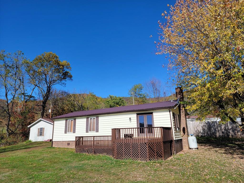 Experience the charm of country living in this completely remodeled double-wide home located just outside the Town of Independence.   Effective age of this home is less than 10 years.  This beautifully updated residence features newer flooring, a tile shower, modern kitchen cabinets, countertops, walk in closets and much more.  Newer Coleman heat pump with air.   Metal roof and vinyl siding with brick foundation makes it a low maintenance dream.  Nice level yard for kids or pets.  Enjoy the tranquility of rural life while being just 3 miles from town.