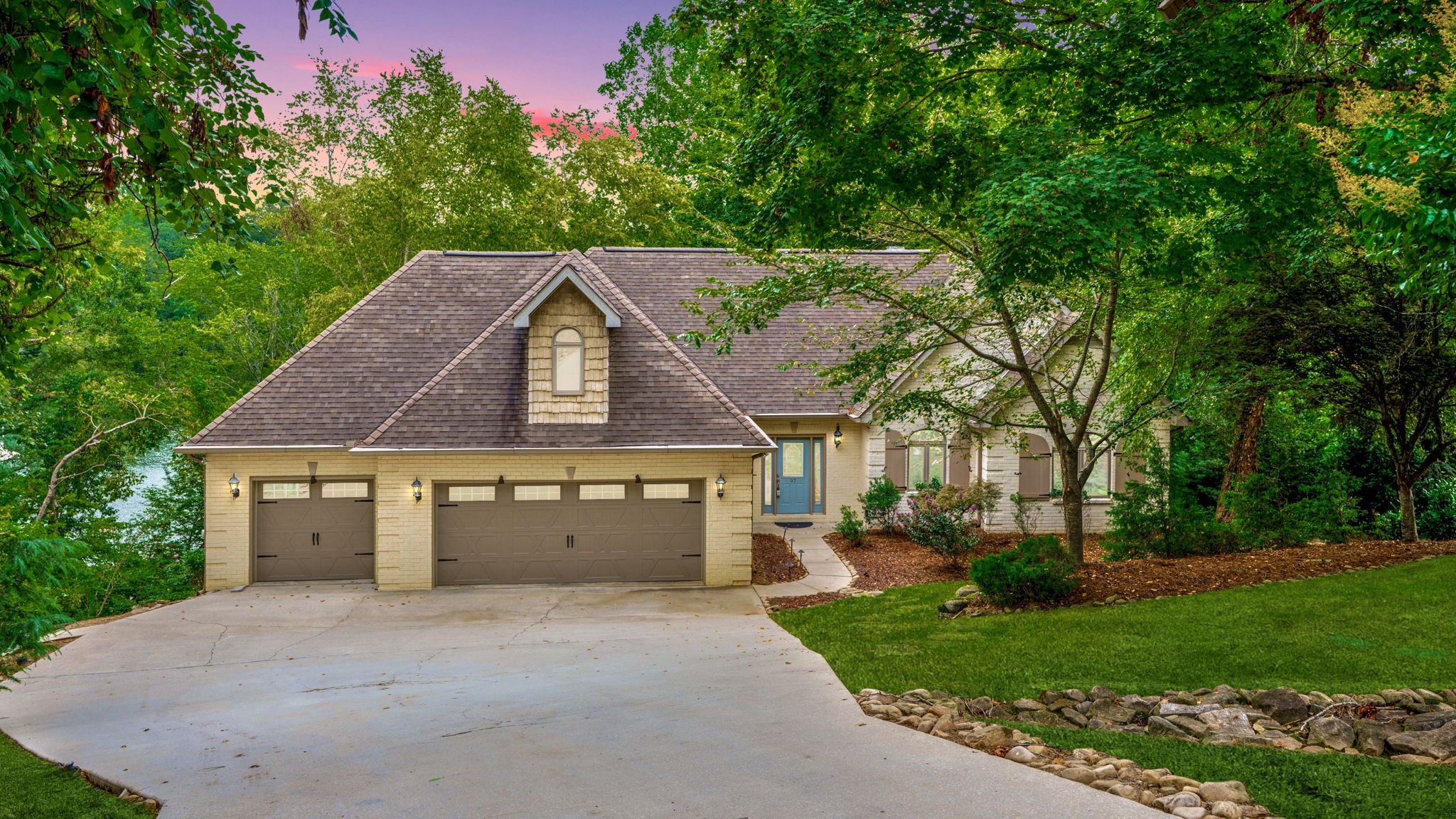 Discover exceptional lakeside living in this stunning custom built home located on a cul-de-sac in the highly sought after Hopkins Point community. Boasting 220 ft of pristine shoreline and year-round water, this property offers some of the best lake access and views on Tims Ford Lake. Enjoy effortless trips to the water with your own private tram system- skip the steps and head straight to the lake in style. The 32x32 double-decker aluminum dock features a boat lift, two jet ski ports, lower-level seating area, and an upper sun deck perfect for soaking in the views. This home is made for entertaining with a 75 ft wraparound upper deck (with propane hookup for your grill), a large screened-in lower-level porch, and panoramic lake views throughout. Inside, the home features refinished hickory hardwood floors, a show stopping floor to ceiling stacked stone fireplace, and a cathedral ceilinged great room offering panoramic lake views. The gourmet kitchen is a chef's dream with exotic granite countertops, built-in sub-zero refrigerator, and JennAir Pro style stainless steel appliances. The primary suite is a true retreat, complete with a steam shower and custom tile inlay. A wine cellar offers an elegant touch for the enthusiast. The 3 car garage includes a 30 ft deep bay- ideal for boats or lake toys. Natural gas powers the fireplace, cooktop, and heat, adding efficiency and comfort throughout. Centrally located on the lake and close to all Tims Ford has to offer, this one-of-a-kind property is the ultimate blend of luxury, convenience, and lakeside tranquility. Septic is permitted for 2 bedrooms, however this home has 4 rooms being utilized as bedrooms and can comfortably sleep 12. Home sells furnished - just bring your toothbrush! As a bonus, residents of Hopkins Point enjoy exclusive access to a private, gated community boat ramp (with small annual fee), offering additional convenience for launching watercraft. No HOA. See attachment for full list of amenities.